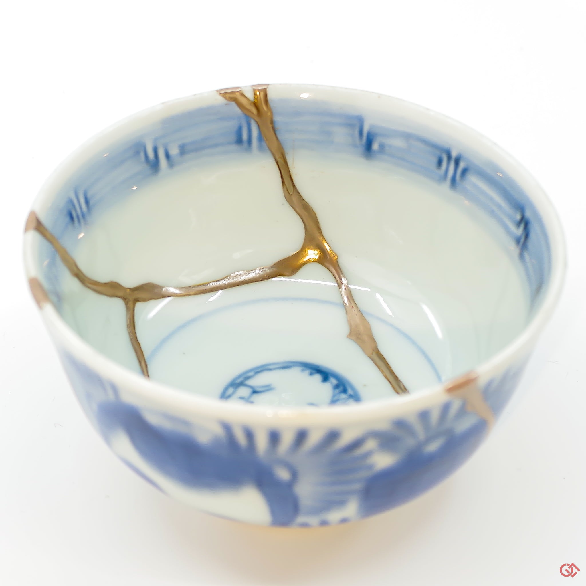 A close-up photo of an authentic Kintsugi pottery piece, showing the detail of its repairs and artisty. craftsmanship.