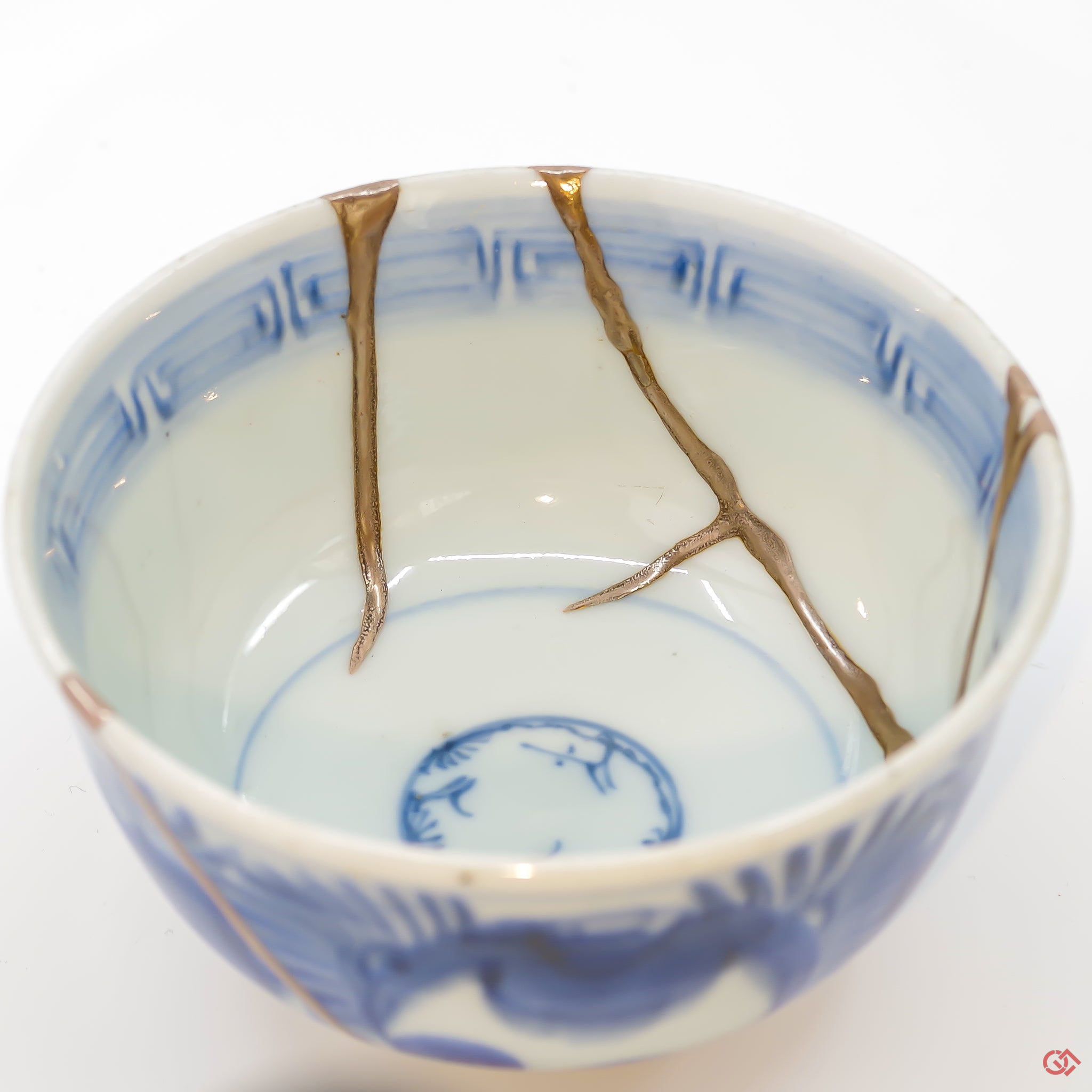 A close-up photo of an authentic Kintsugi pottery piece, showing the detail of its repairs and artisty. craftsmanship.