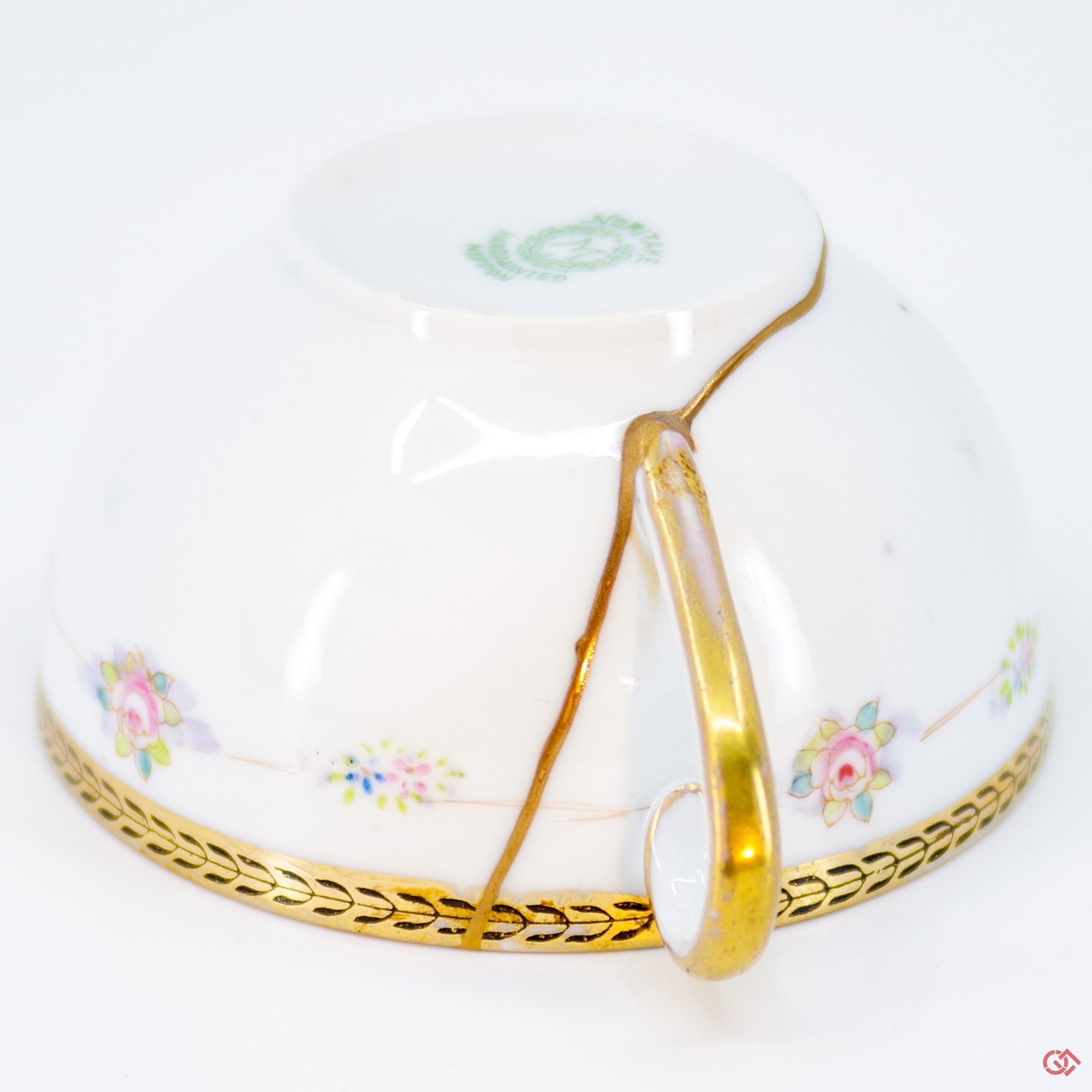 Close-up photo of an authentic Kintsugi pottery piece, showing the detail of its repairs and craftsmanship