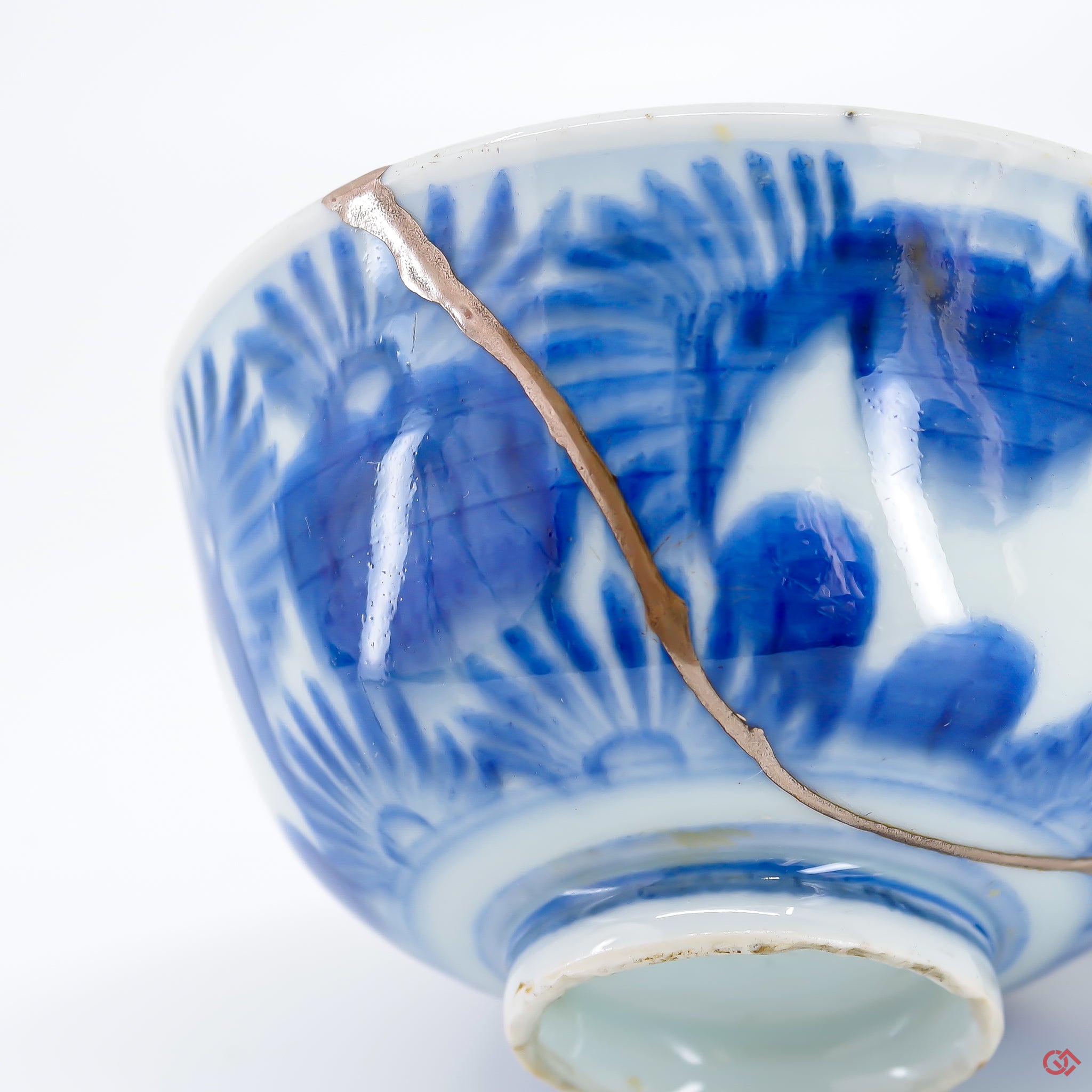 A close-up photo of an authentic Kintsugi pottery piece, showing the detail of its repairs and artisty. craftsmanship.