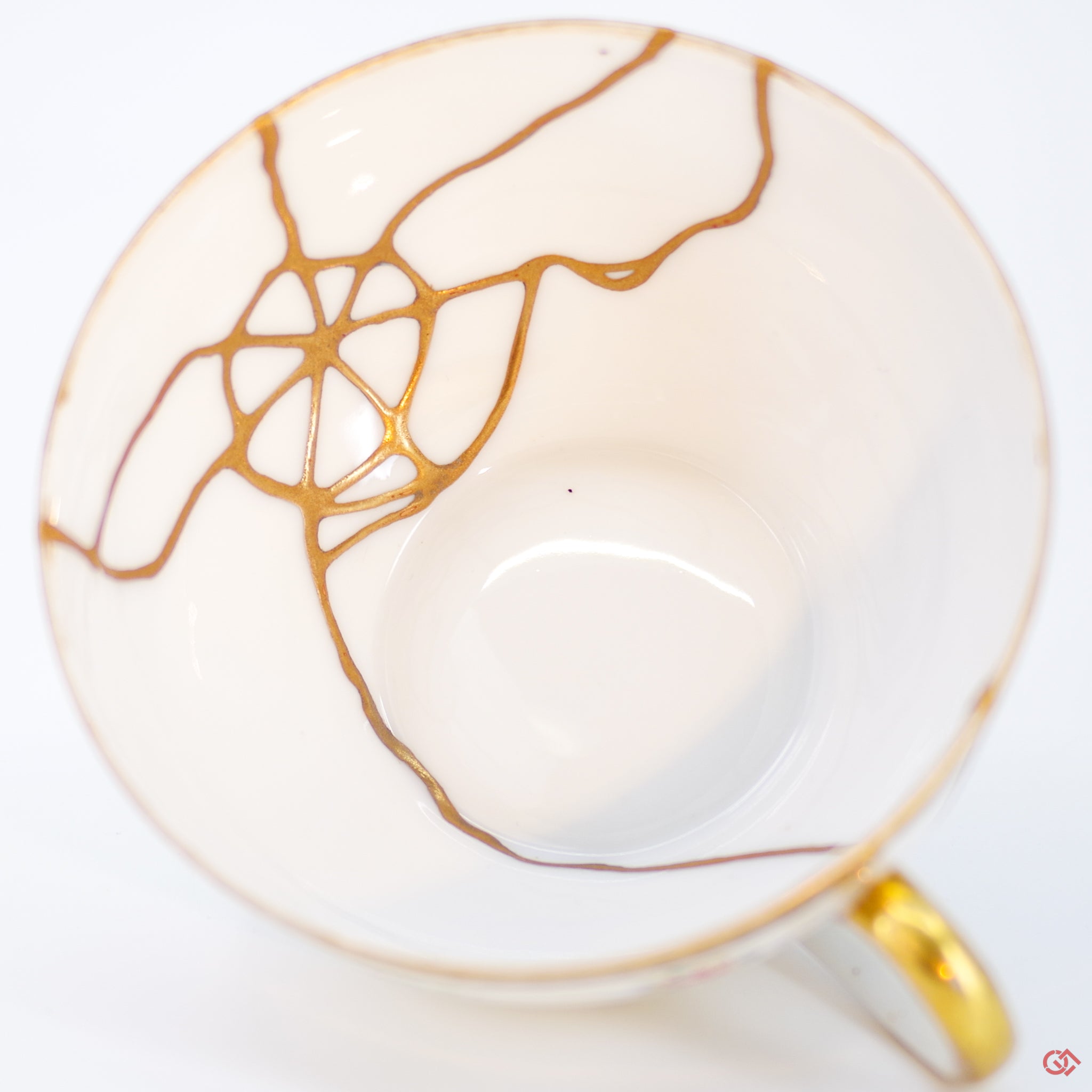 Close-up photo of an authentic Kintsugi pottery piece, showing the detail of its repairs and craftsmanship