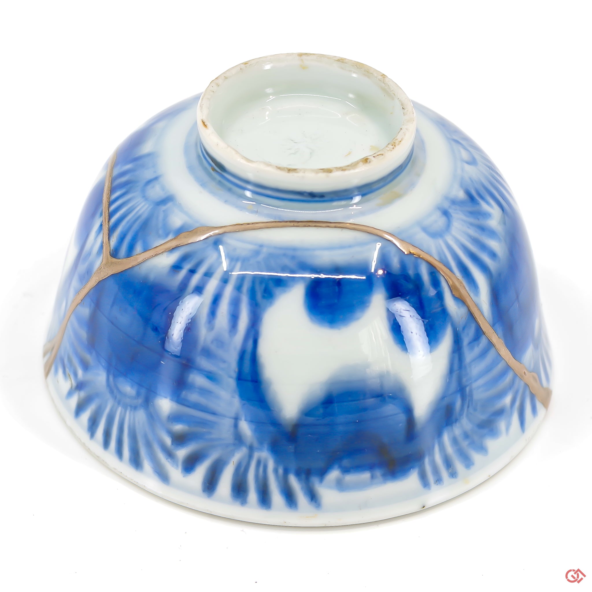 A close-up photo of an authentic Kintsugi pottery piece, showing the detail of its repairs and artisty. craftsmanship.