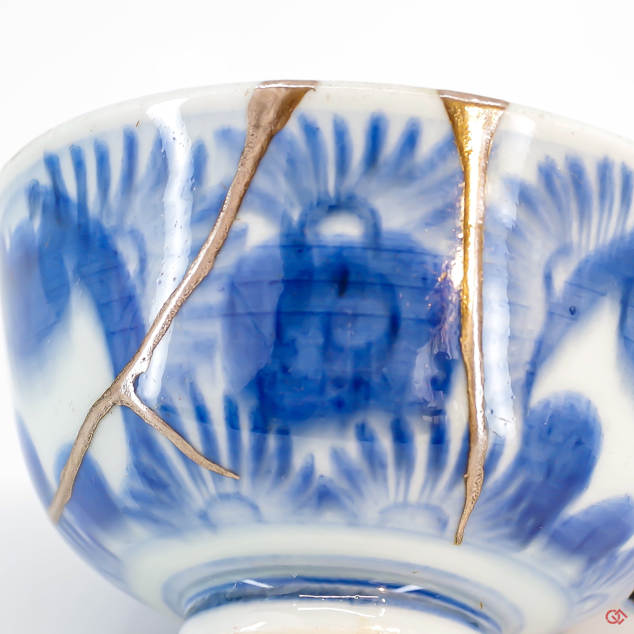 A close-up photo of an authentic Kintsugi pottery piece, showing the detail of its repairs and artisty. craftsmanship.