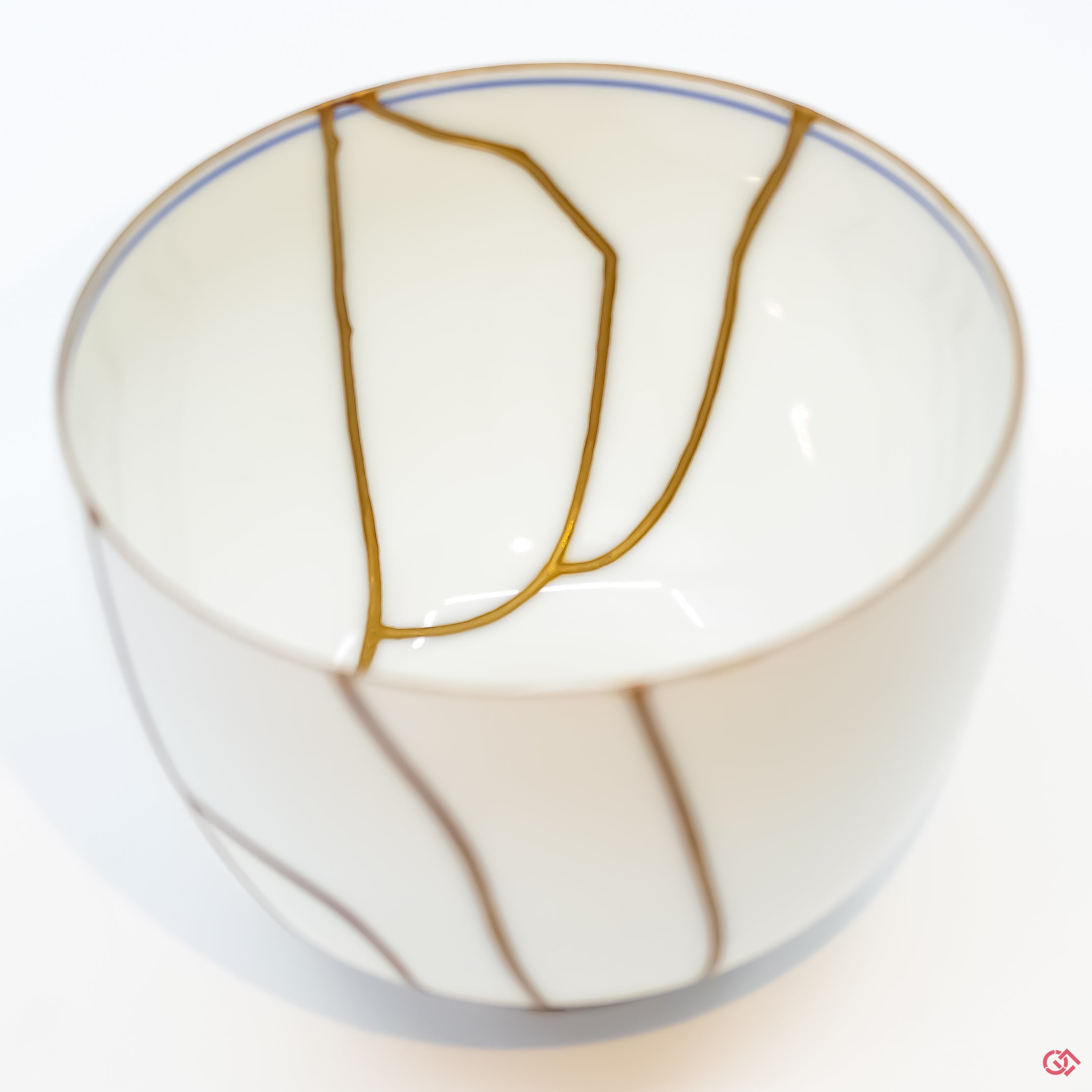 Close-up photo of an authentic Kintsugi pottery piece, showing the detail of its repairs and craftsmanship