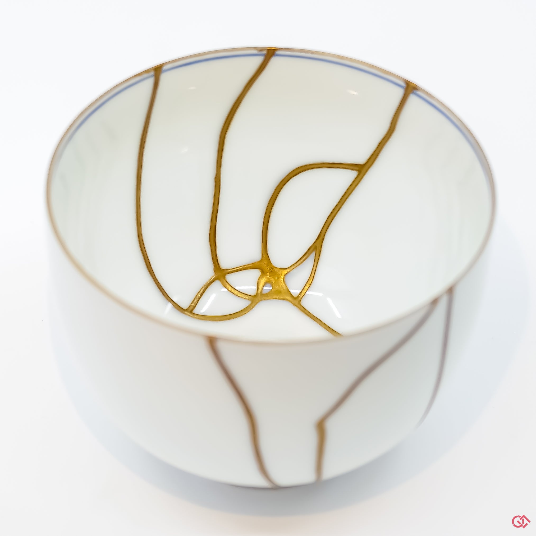 Close-up photo of an authentic Kintsugi pottery piece, showing the detail of its repairs and craftsmanship