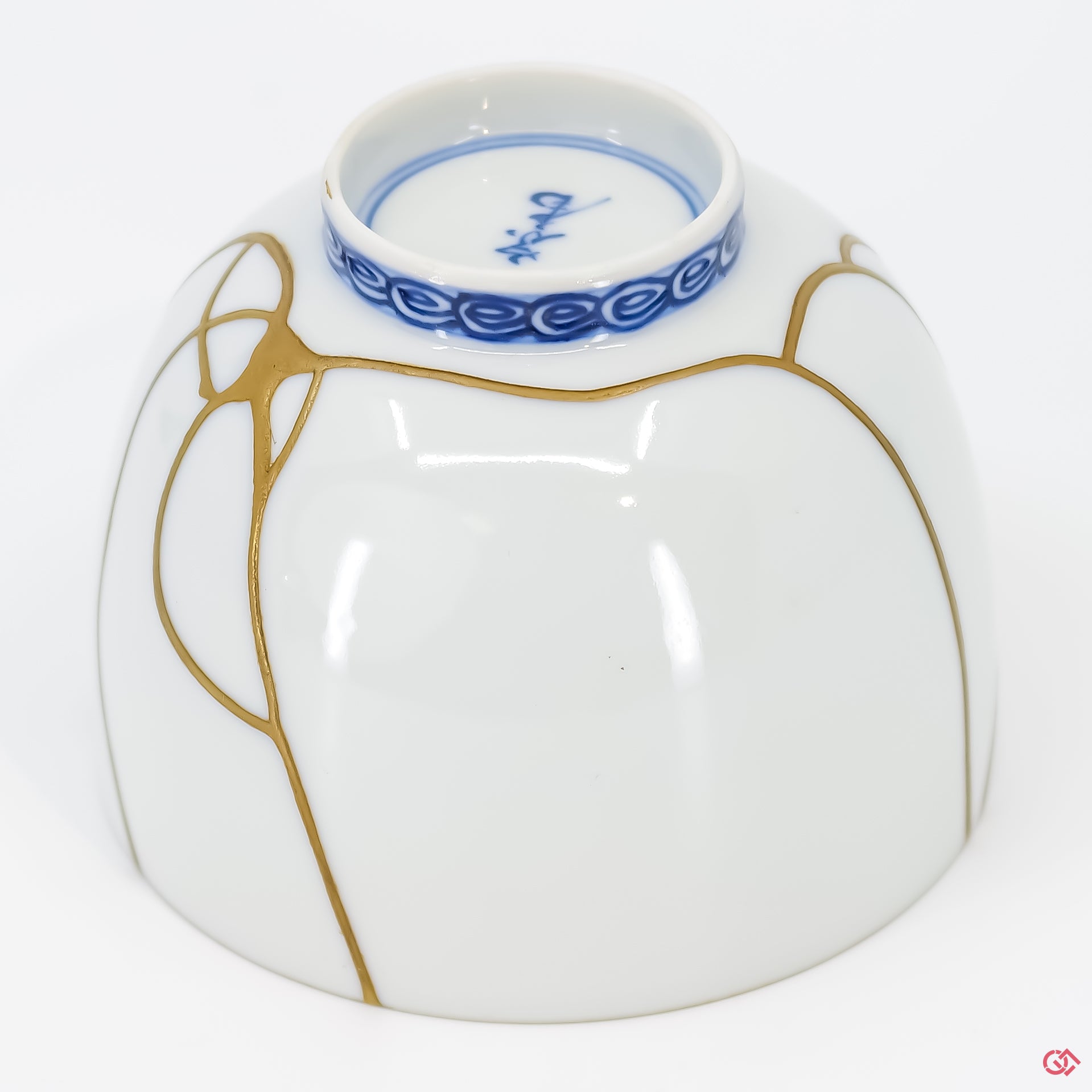 Close-up photo of an authentic Kintsugi pottery piece, showing the detail of its repairs and craftsmanship