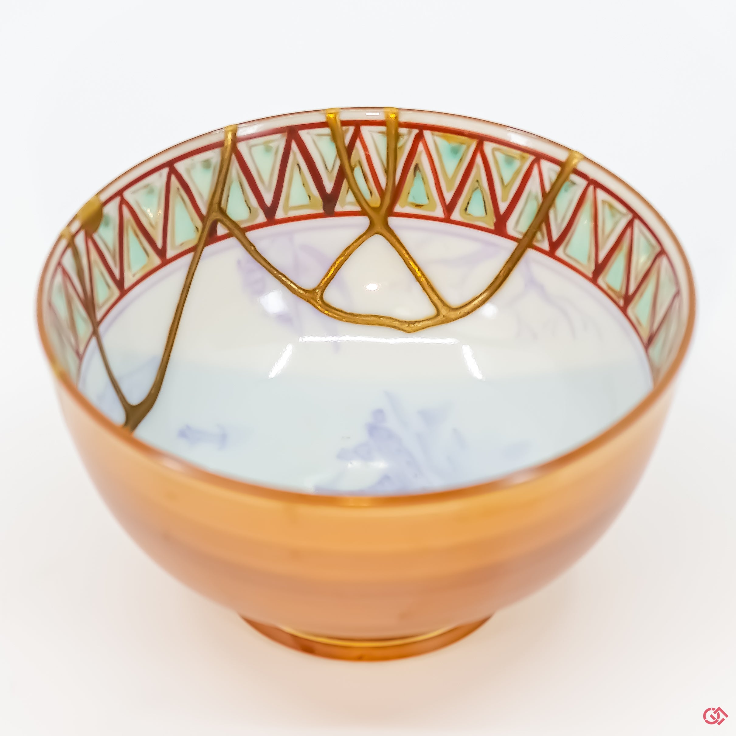 Buy the Japanese art of Kintsugi up close: Witness the delicate brushstrokes of gold that transform imperfection into beauty.