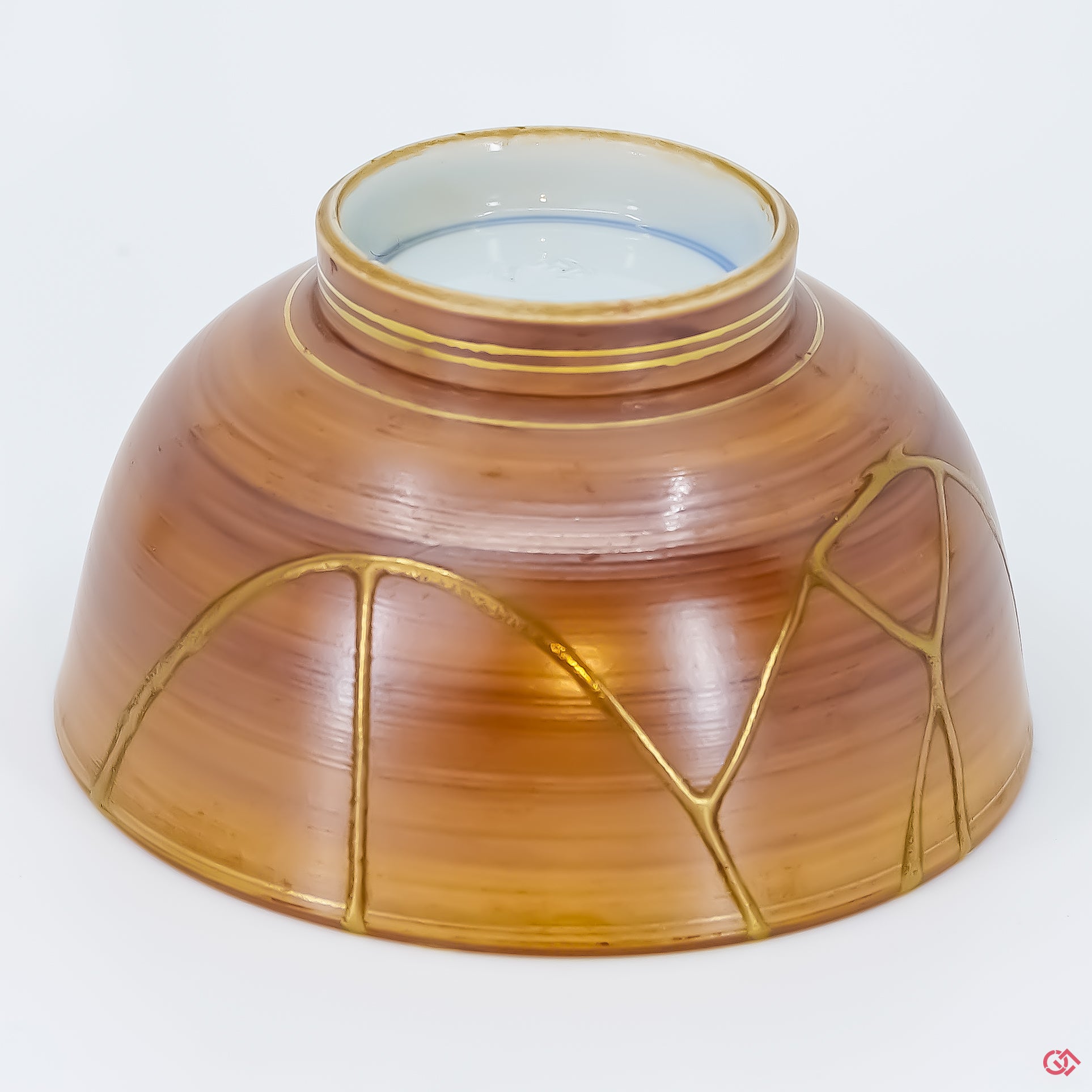 Buy the Japanese art of Kintsugi up close: Witness the delicate brushstrokes of gold that transform imperfection into beauty.