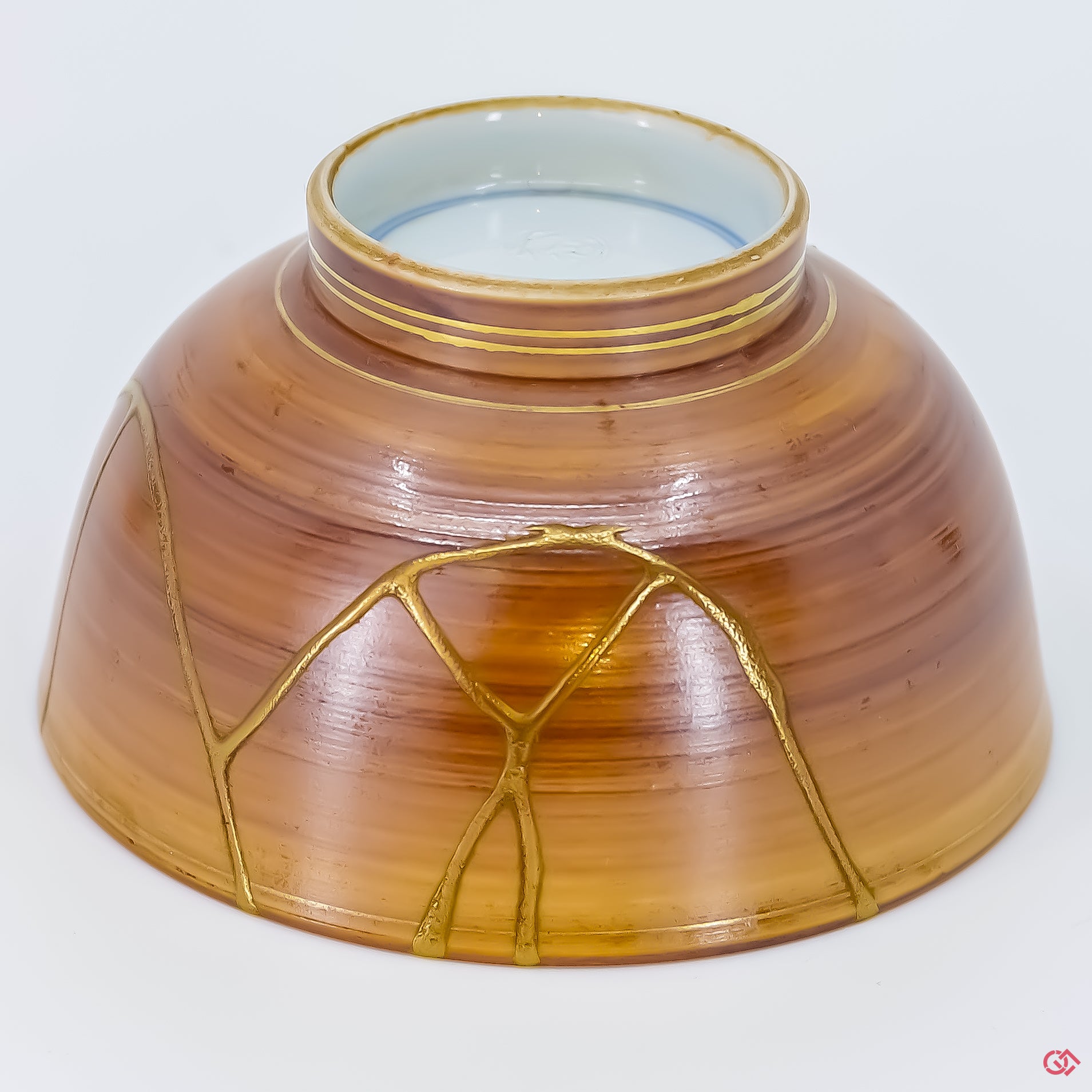 Buy the Japanese art of Kintsugi up close: Witness the delicate brushstrokes of gold that transform imperfection into beauty.