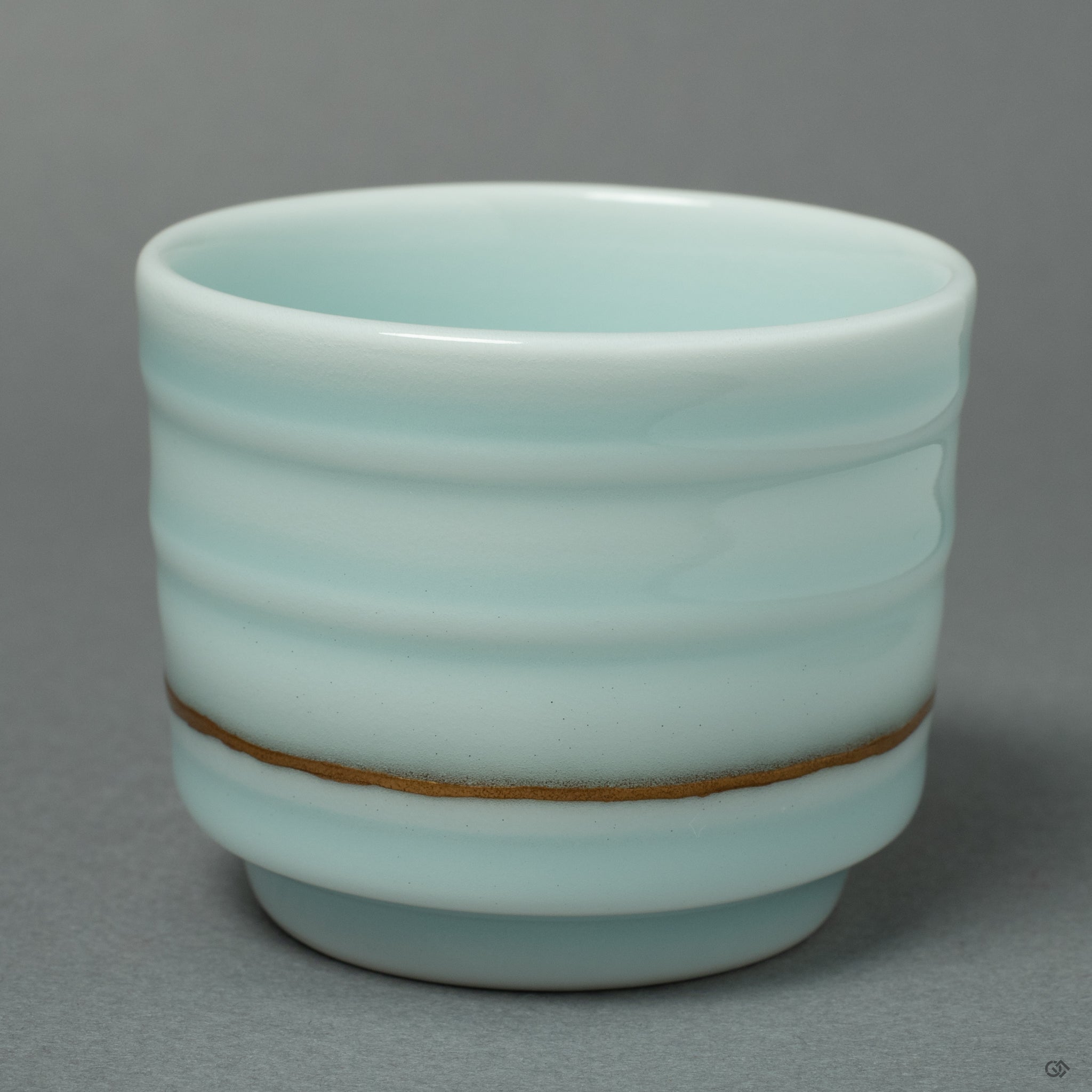 An intimate look at the intersection of two golden Kintsugi lines, forming a unique 'keshiki' (scenery) on the cup's surface that tells the story of its rebirth.