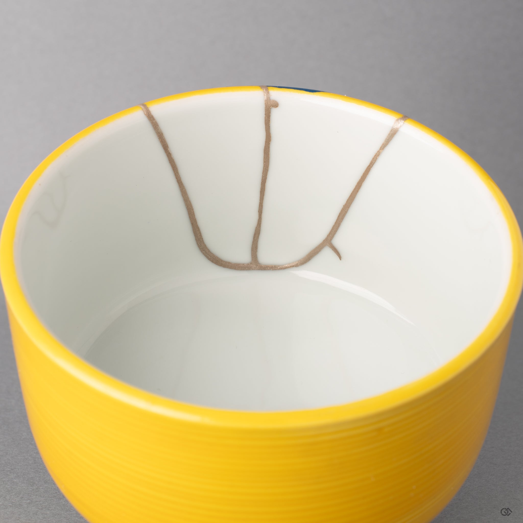 Interior close-up of the seams: silver kintsugi glows, creating a powerful sense of restorative beauty as the vessel is mended.