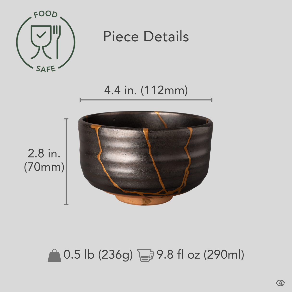 This gray Arita kintsugi matcha bowl shown with scale reference, bold gold lines crossing its minimalist form, crafted resilience in proportion.