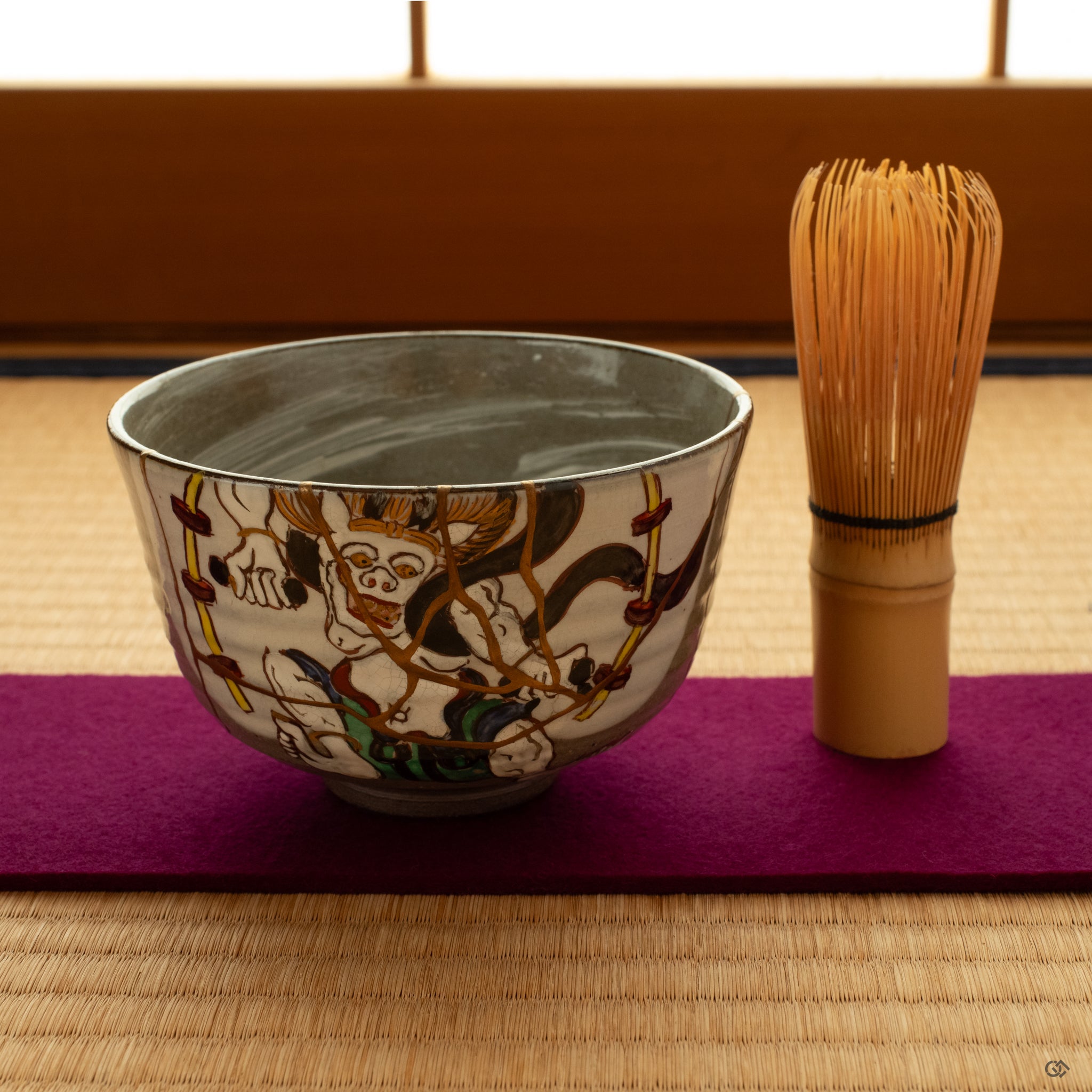 Kintsugi bowl set on a tatami mat in soft light. This legacy piece encourages an intentional living that honors heritage.