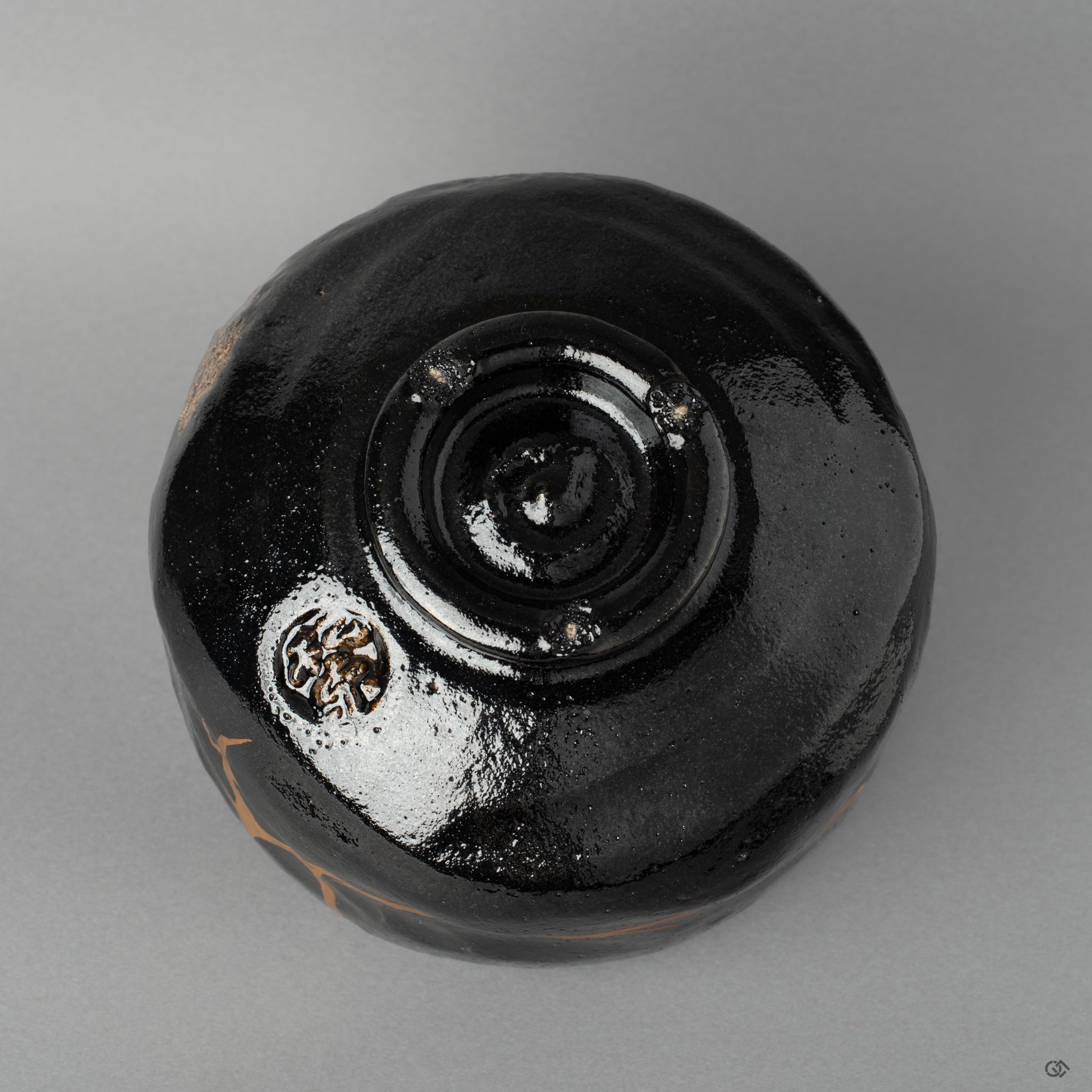 Alternate bottom angle of a Kyoto matcha bowl with kintsugi restoration, each seam holding history made visible.