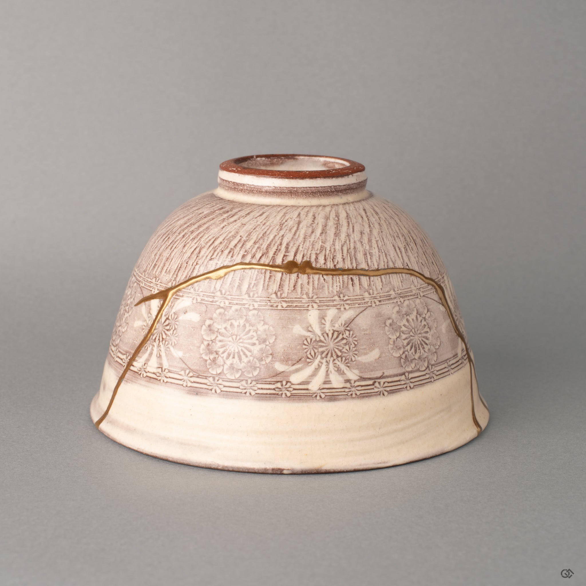 Profile of a purple Kyoto matcha bowl, gold kintsugi threads following its gentle curve, beauty in imperfection given form.