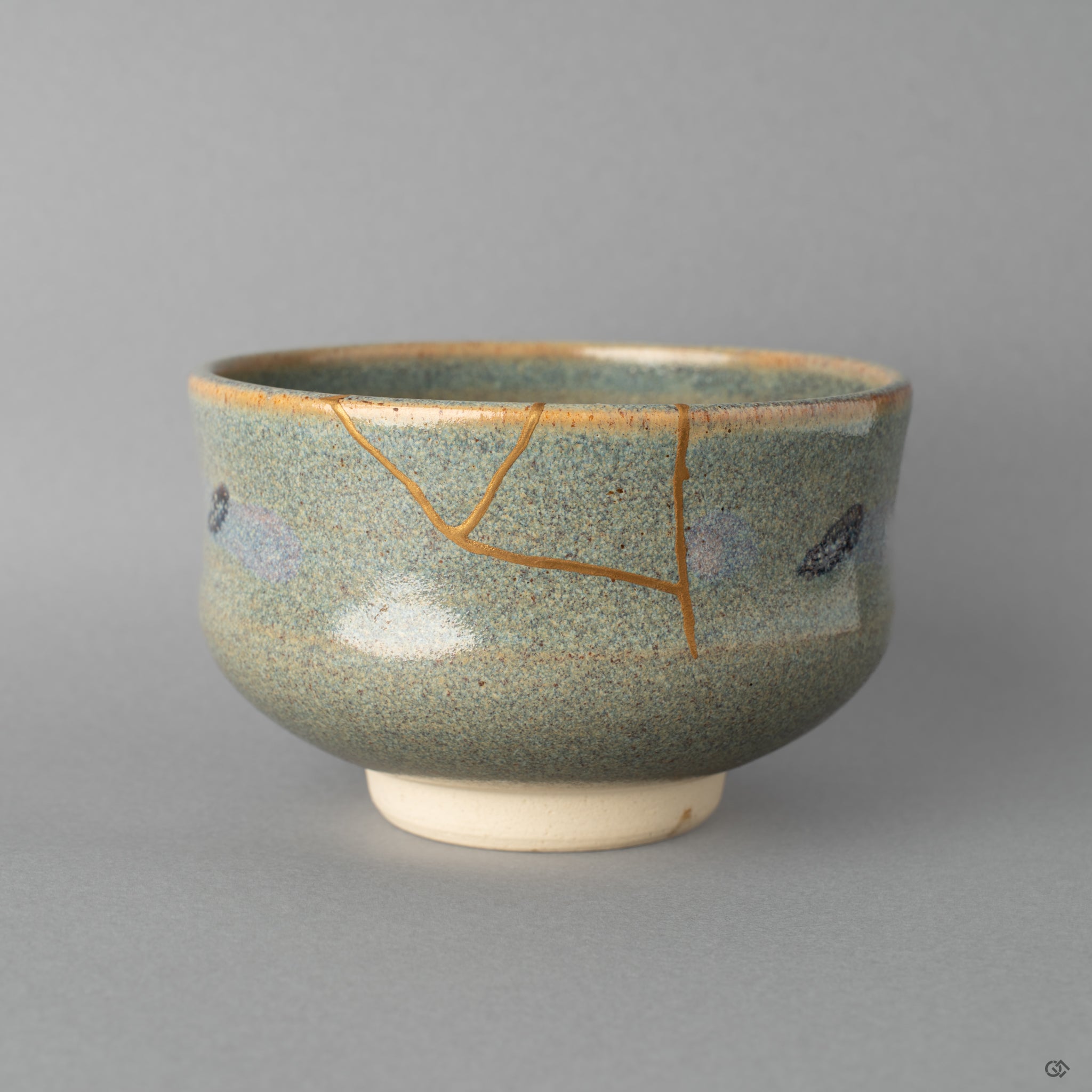 Front view of a Kyoto matcha bowl restored with urushi and 24k gold kintsugi, embodying heritage luxury and craft.