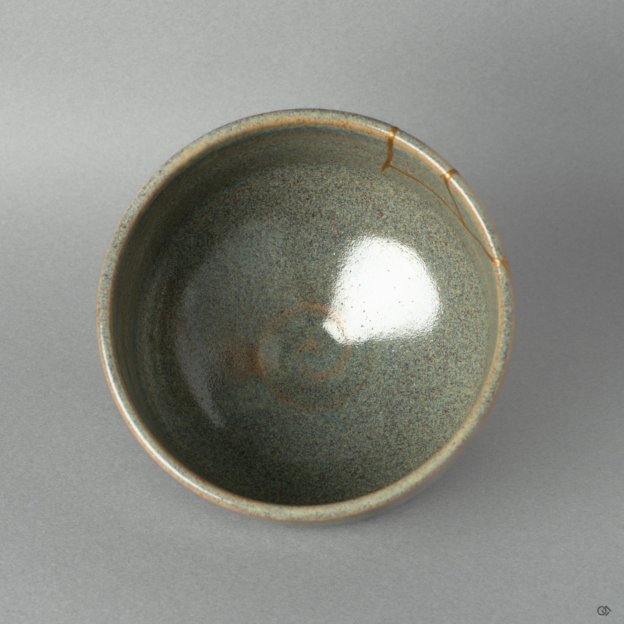Top view of a Kyoto kintsugi matcha bowl with 24k gold and urushi lacquer, revealing the art of mindful restoration.