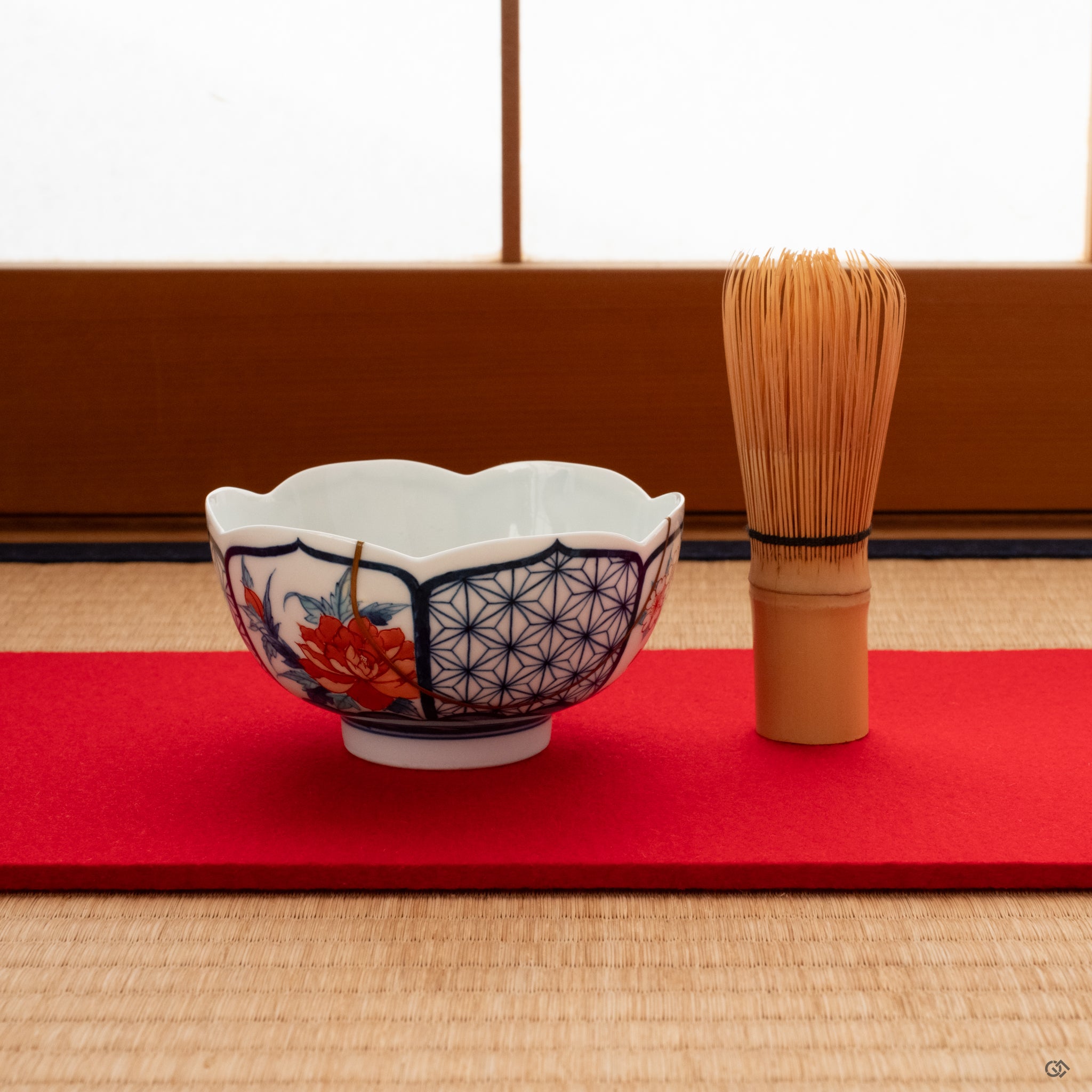 Nabeshima kintsugi matcha bowl on tatami mat, 24k gold seams glinting softly, embodying the spirit of living philosophy.