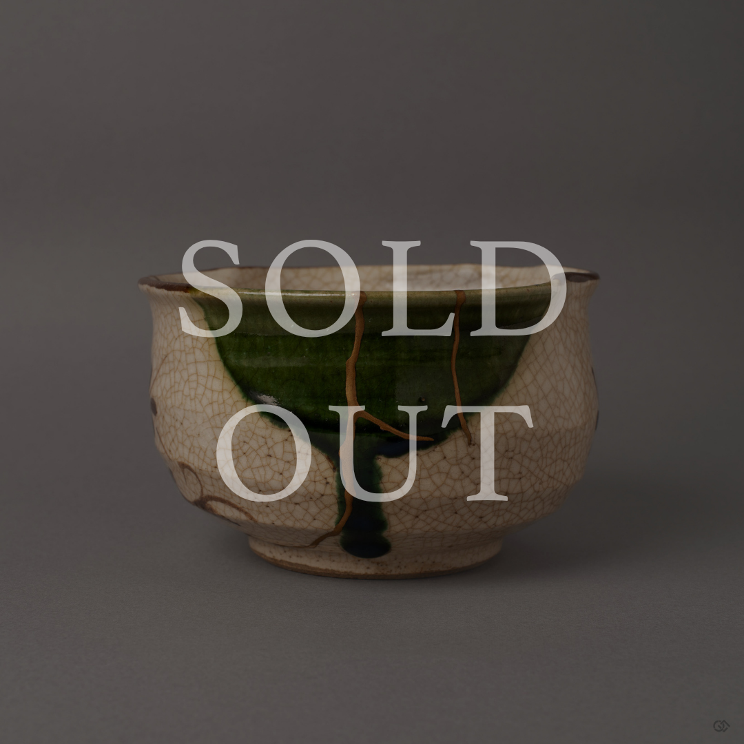 Sold out: kintsugi Oribe ware matcha bowl with 24K gold restoration over crackled ivory and copper-green glaze.