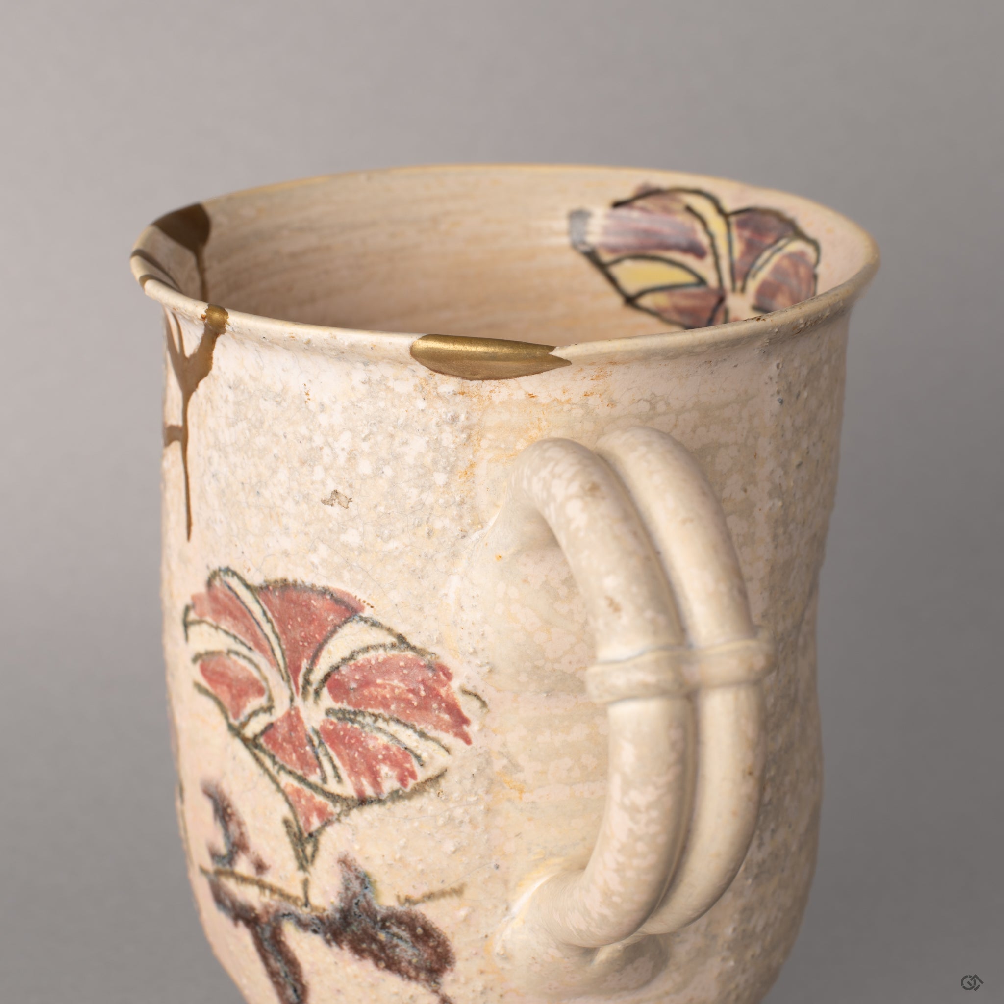 Urushi lacquer beneath 24K gold on this Kyoto mug, each kintsugi seam polished smooth, beauty in imperfection up close.
