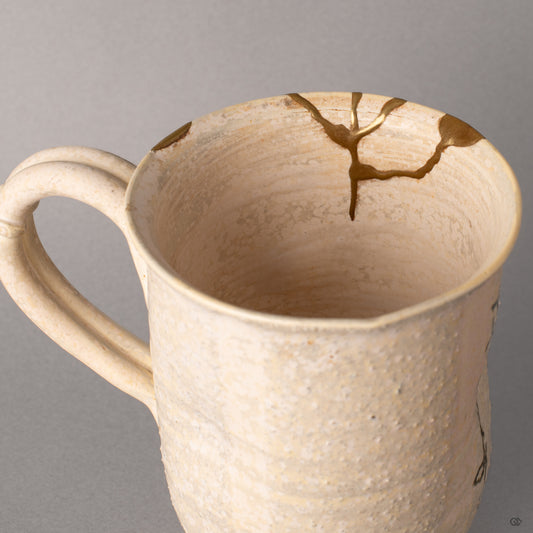 Inside this Kyoto mug, kintsugi lines thread through the glazed interior, urushi depth and living philosophy within.