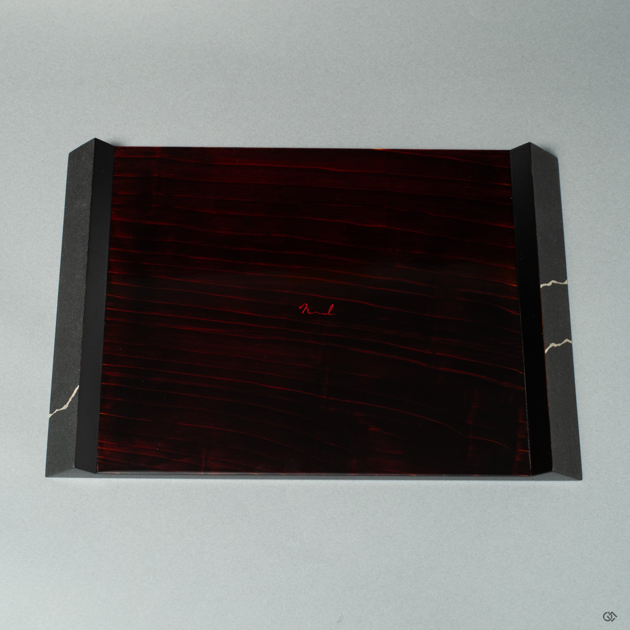 Flat black wooden plate with, fine silver technique, shown from the back view, highlighting Japanese craftsmanship and wabi-sabi elegance