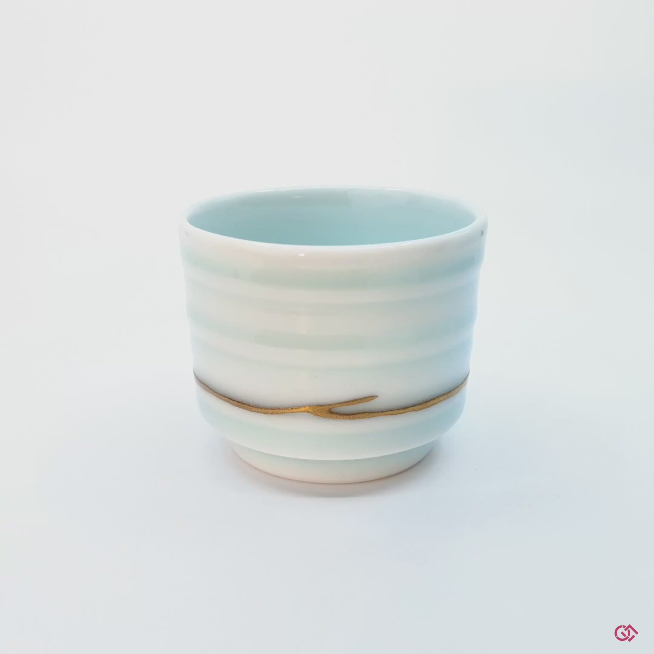 Discover the magic of Kintsugi: Watch a rotating video showcasing the beauty of repaired pottery.