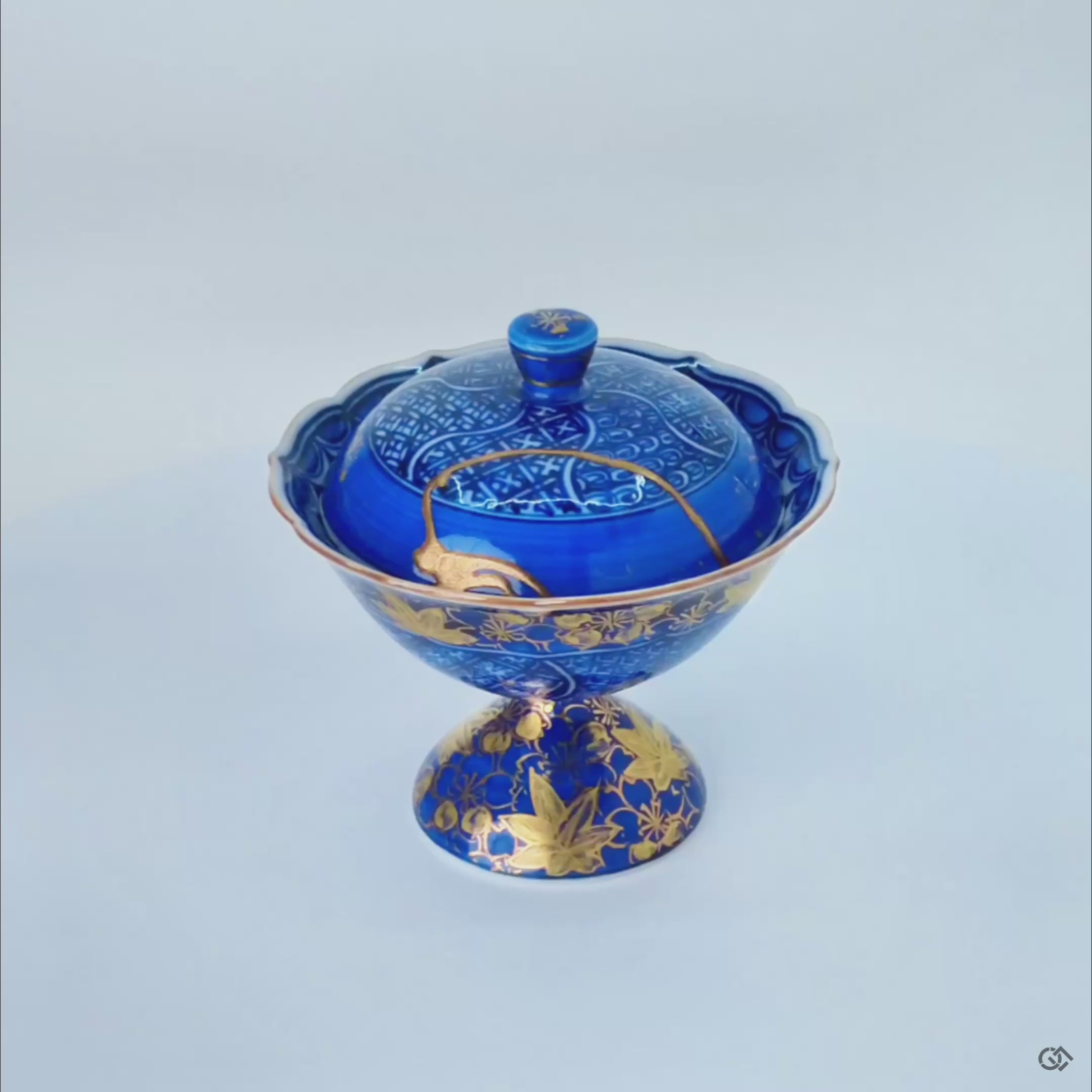 A 360-degree video of the Kyoto ware lidded cup, displaying its dual-sided kintsugi from every angle, a vision of resilience made beautiful.