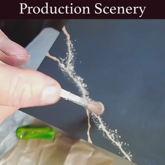 Video capturing the hand-painted silver kintsugi lines on a wooden black lacquer plate, crafted in the spirit of urushi artistry