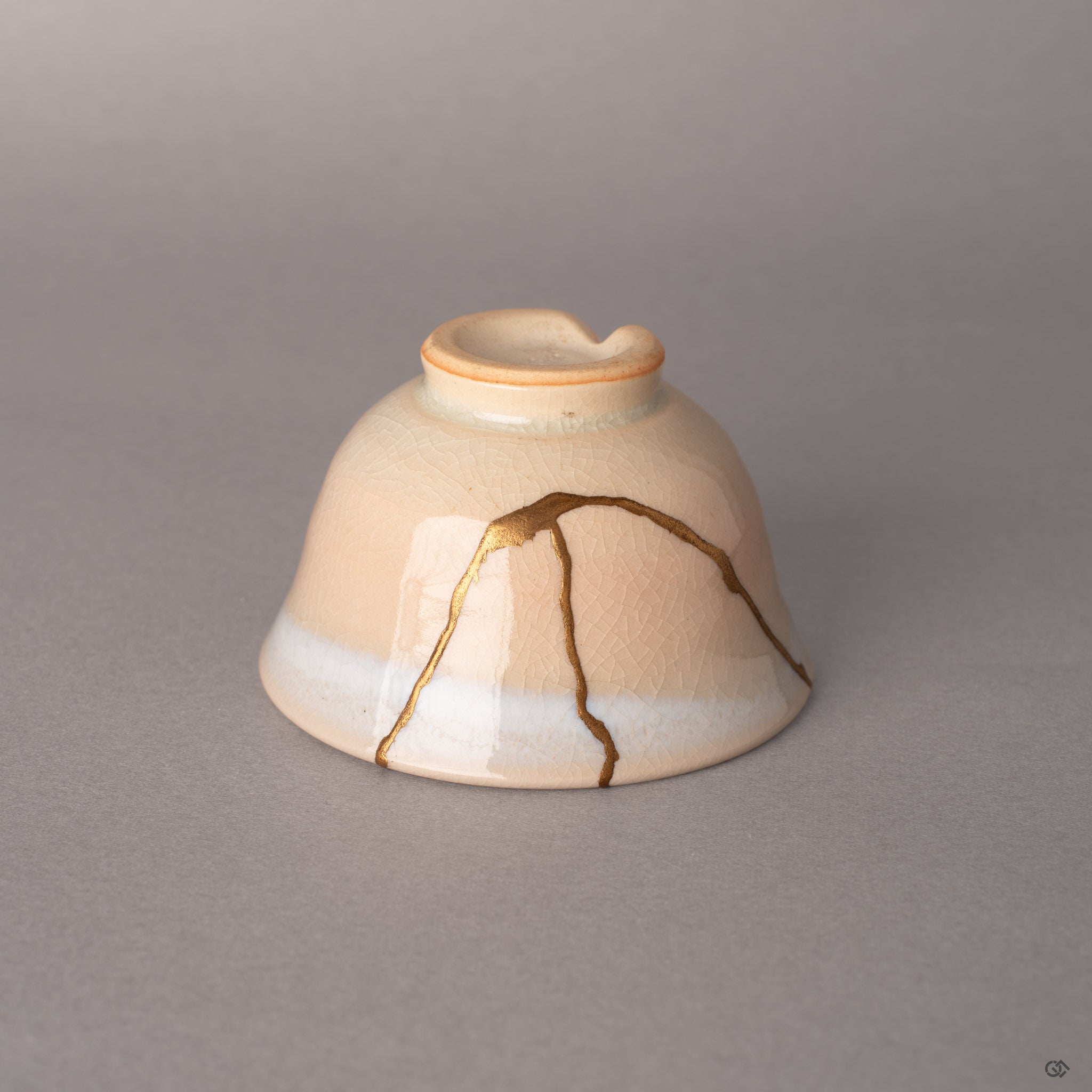 Detail of 24K gold kintsugi against Hagi's iconic crackle glaze, where fractures become philosophy.