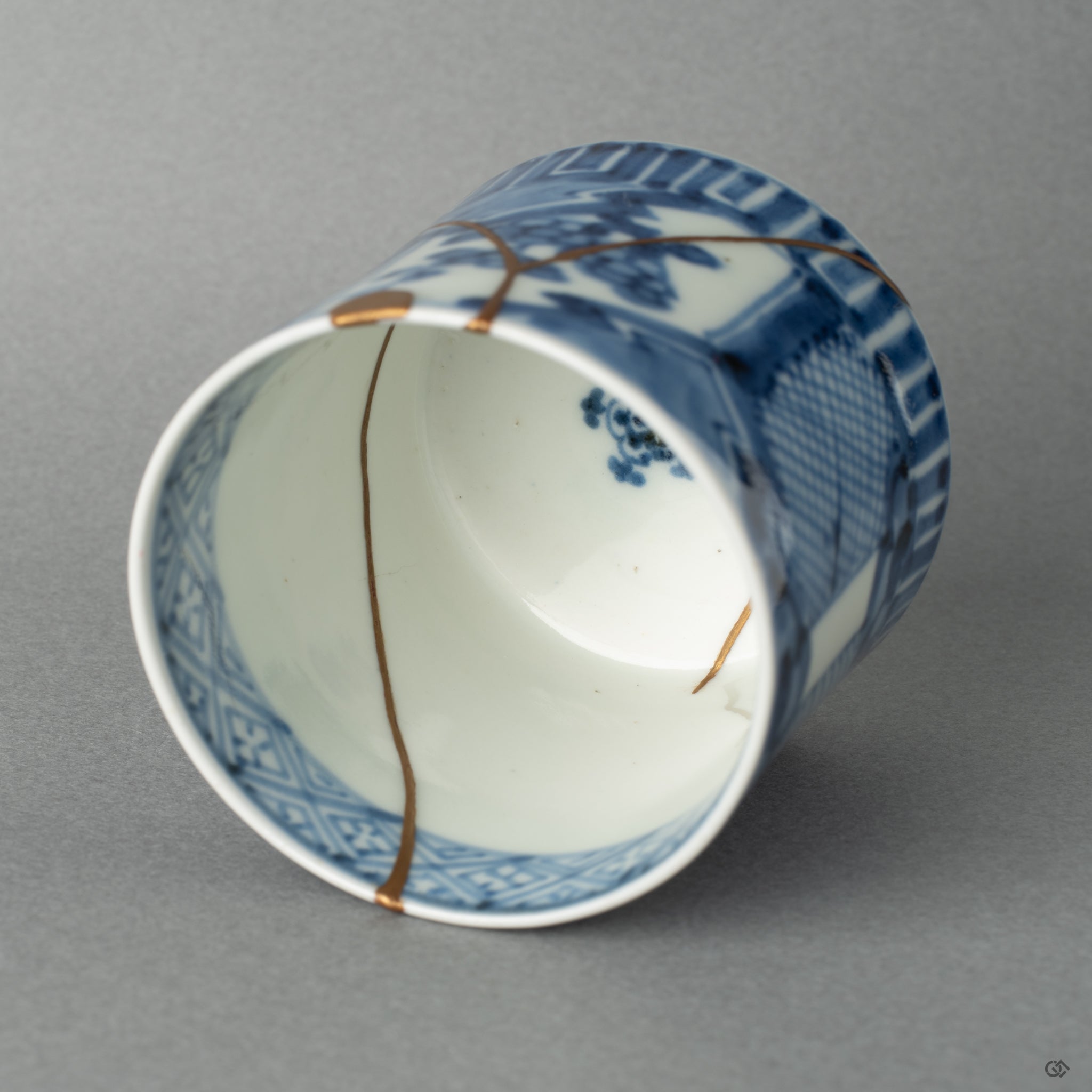 The delicate kintsugi line curves along the interior wall, a physical manifestation of visible resilience and strength.