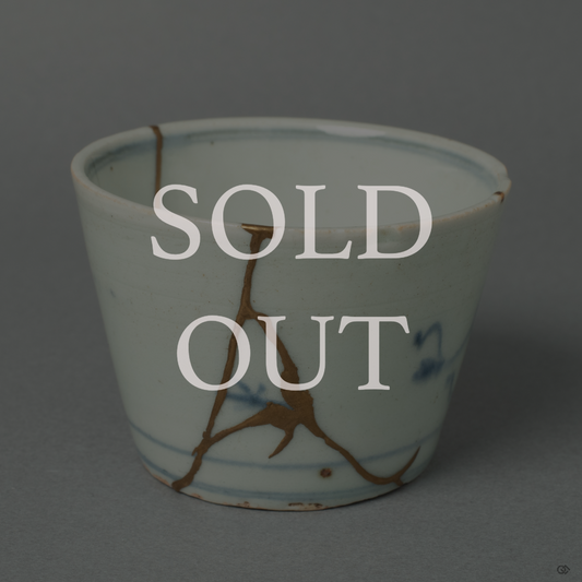 Sold: An elegant, white Ko-Imari porcelain soba-choko cup, its history honored with fine lines of 24k gold Kintsugi repair.