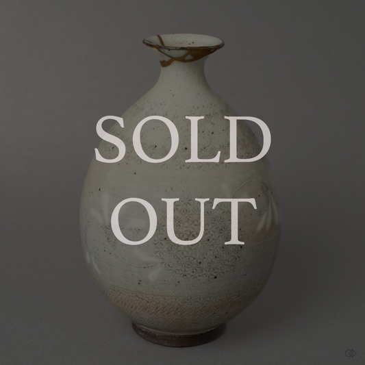 This sold-out piece of Japanese Kintsugi art features a Kyoto ware pottery tokkuri (sake bottle). A prime example of wabi-sabi philosophy, the broken ceramic is mended with gold, creating a unique and valuable object.