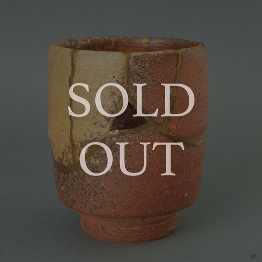 Sold: A rustic Shigaraki ware vessel, expertly restored with 24k gold Kintsugi and adorned with a delicate Nashiji 'pear-skin' lacquer finish.