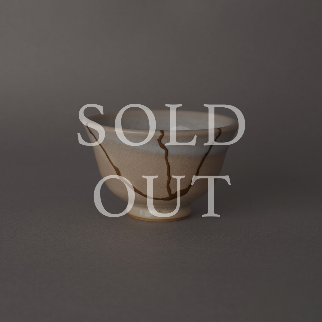Sold out — A Hagi ware cup with crackled cream glaze, restored with authentic 24K gold kintsugi and natural urushi lacquer. This one-of-a-kind piece by The Kintsugi Labo JAPAN has found its home.