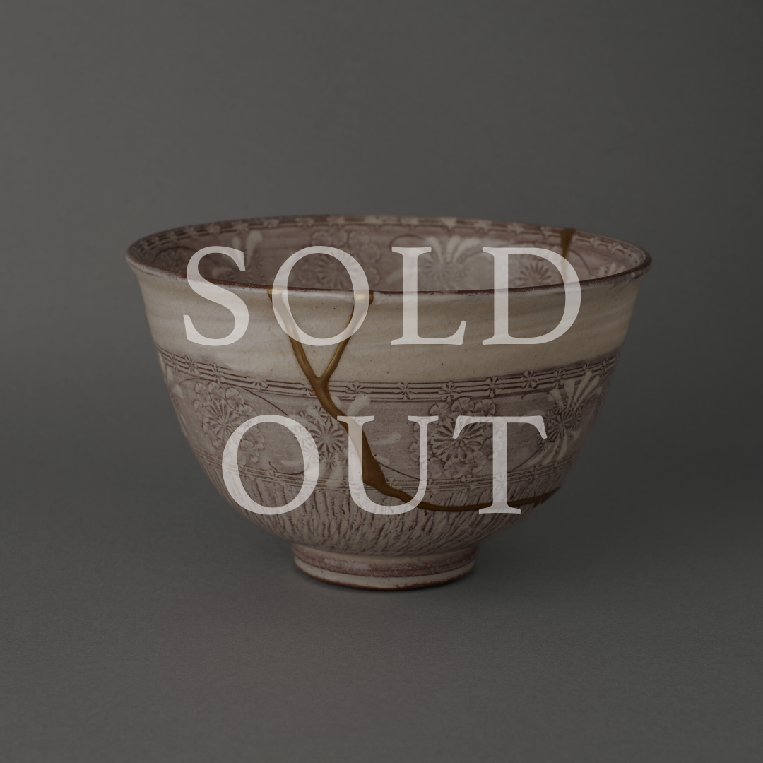 Sold out — A purple Kyoto ware matcha bowl with Mishima pressed patterns, restored with authentic 24K gold kintsugi and natural urushi lacquer. This one-of-a-kind piece by The Kintsugi Labo JAPAN has found its home.
