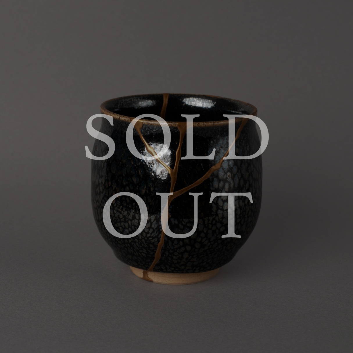 Authentic Japanese Kintsugi Kyo-yaki tea cup, hand restored with urushi and 24K gold, marked sold out.