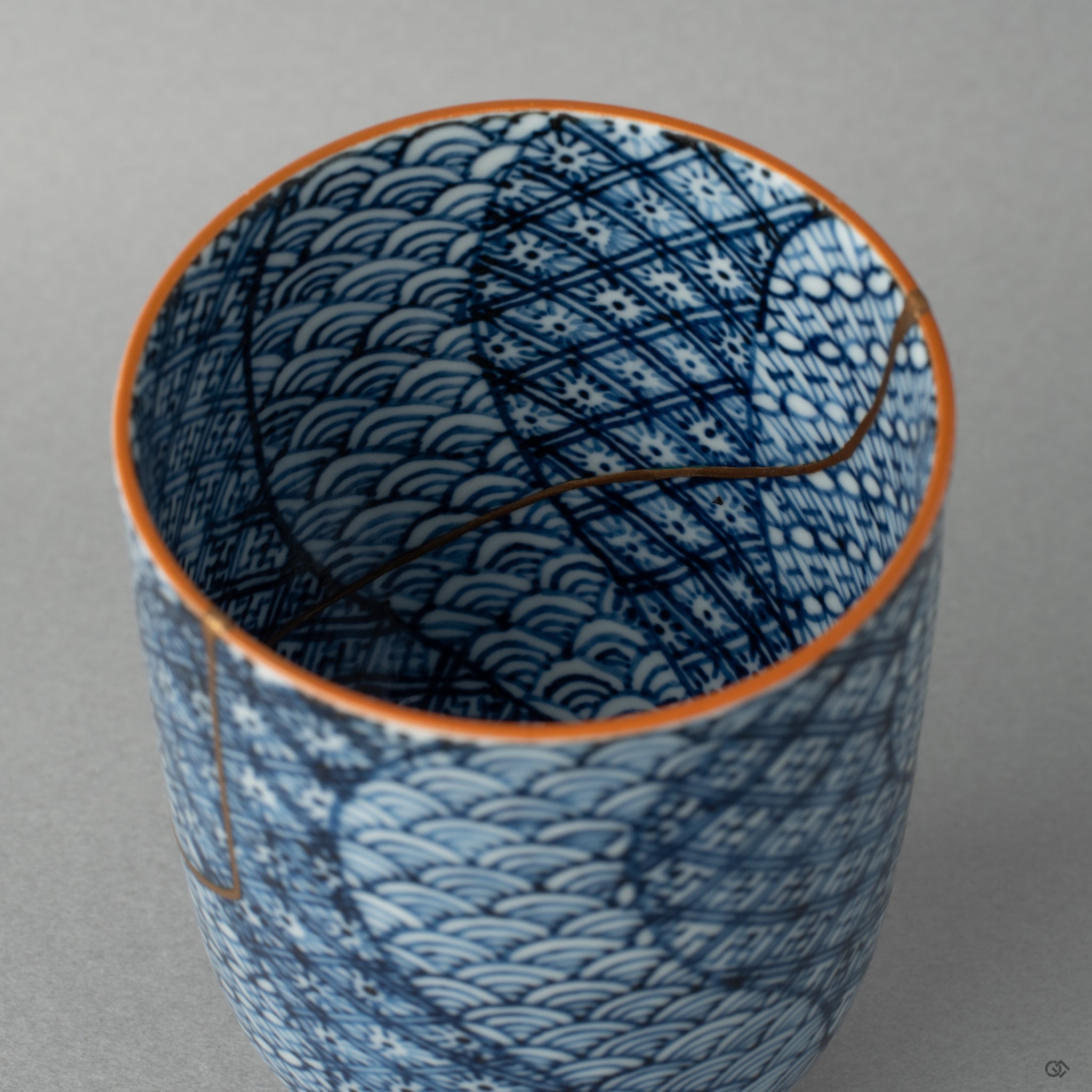 Close view of urushi and gold kintsugi work inside a Kyoto cup, a tactile history you can almost feel.