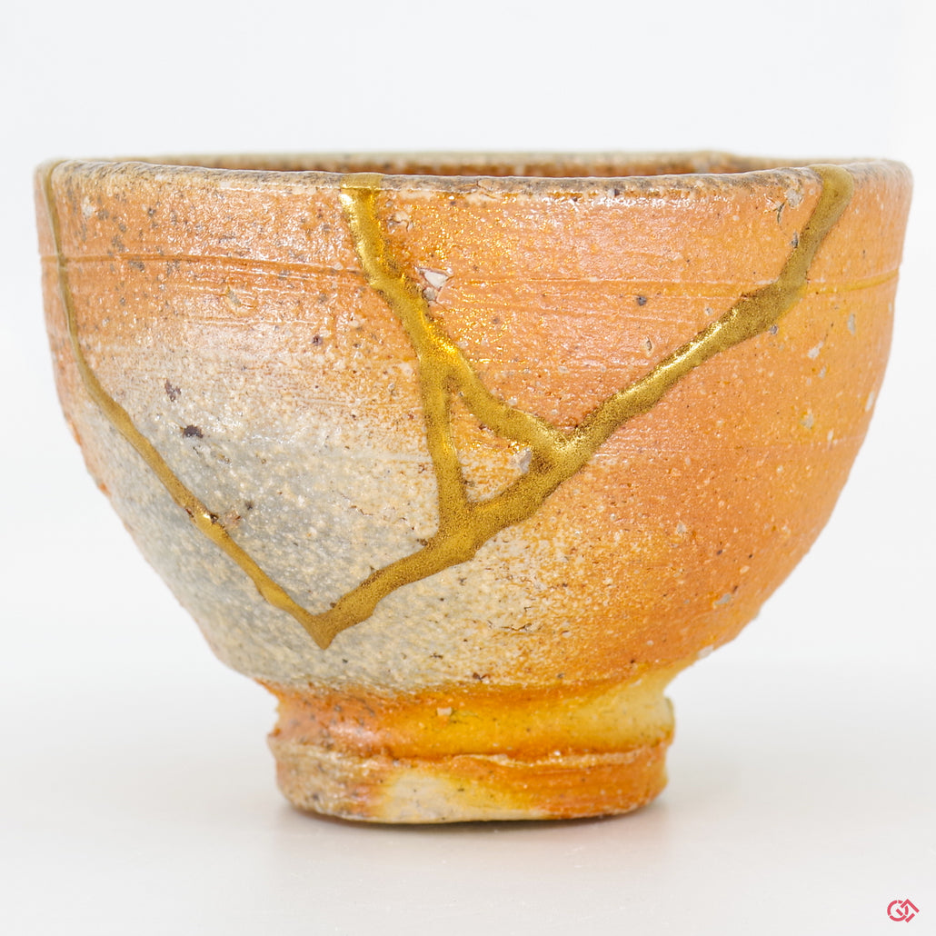 Detailed view of authentic Kintsugi repair, showcasing craftsmanship and gold inlay.