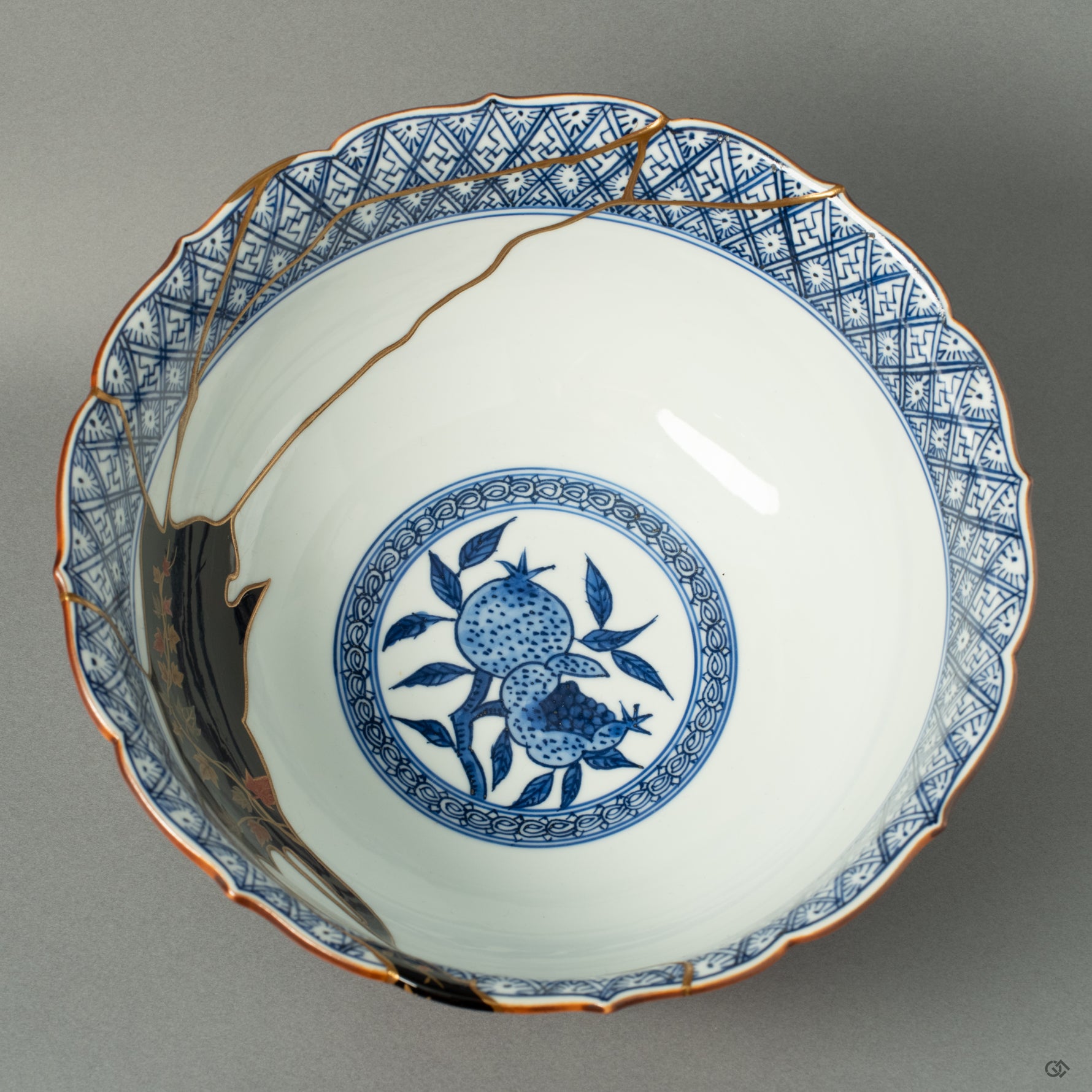 Looking into the vast interior of the Shonzui bowl, revealing the extensive and complex network of Kintsugi repairs, a testament to the vessel's dramatic history and magnificent rebirth.