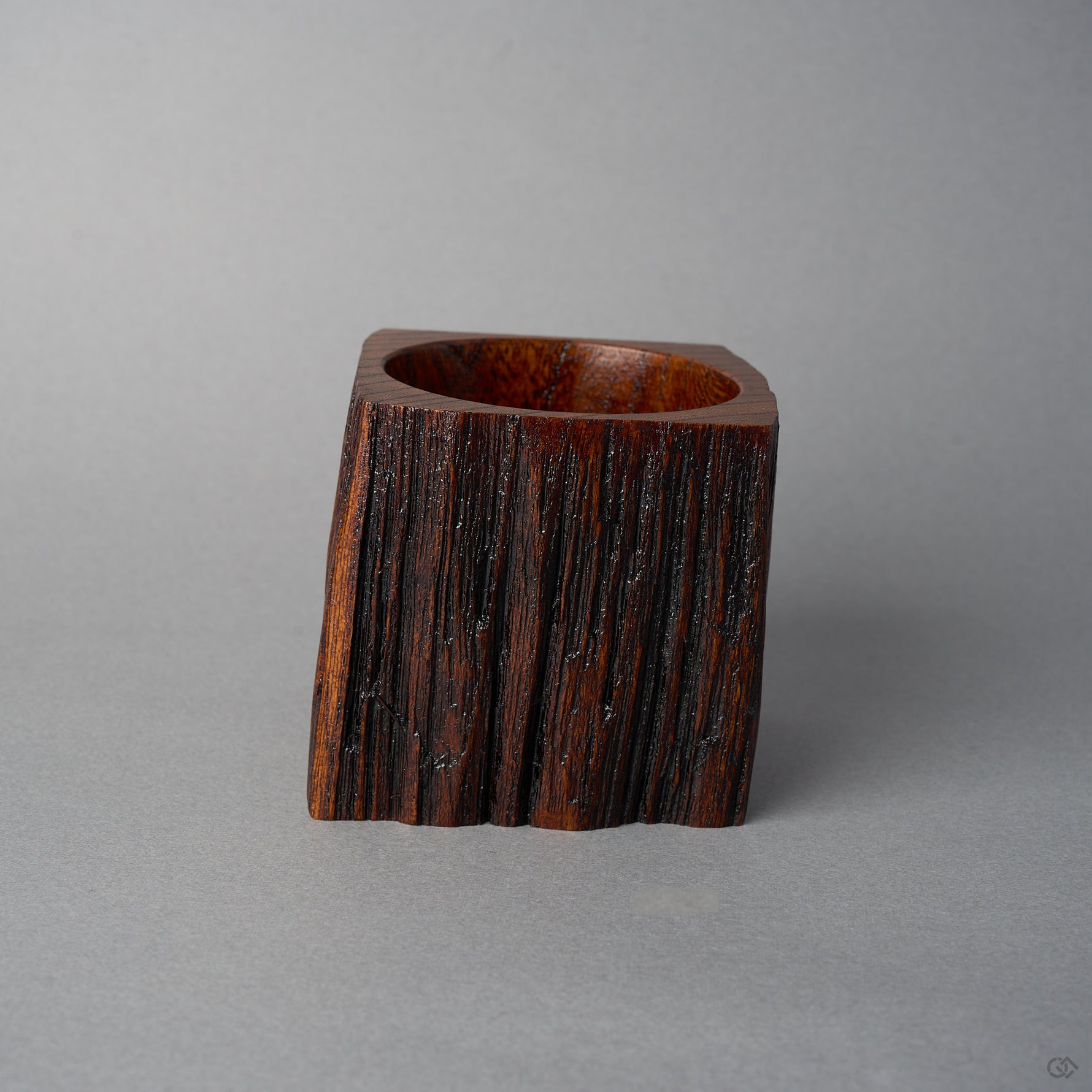 Back view of KODAMA Nashiji by Nobuyasu Suginaka, showing the rough vertical grain and weathered bark texture of the century-old wood around the bowl opening.