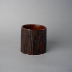 Back view of KODAMA Red Roiro by Nobuyasu Suginaka, showing the rough, weathered bark texture of the century-old wood that forms the body of the vessel.