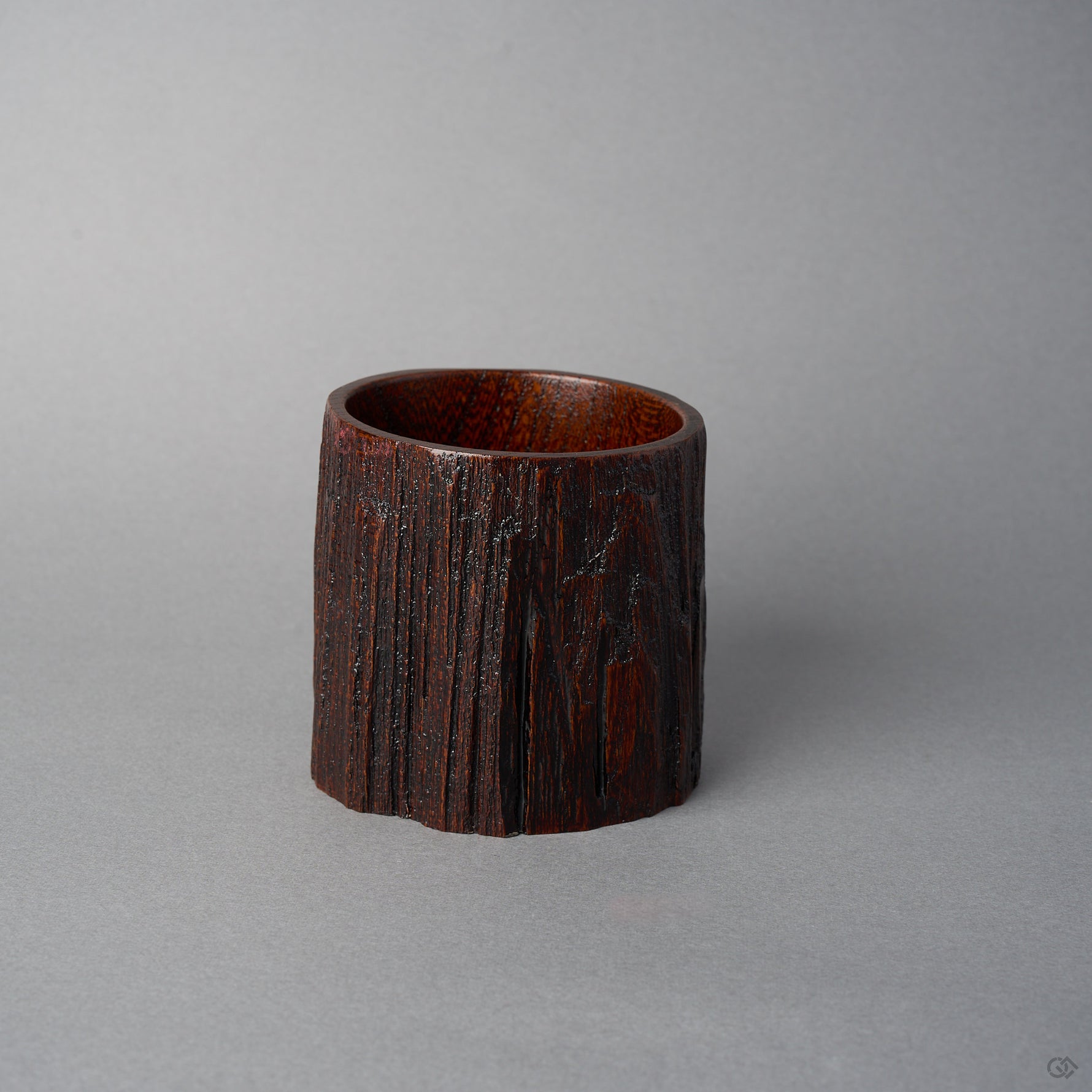 Back view of KODAMA Red Roiro by Nobuyasu Suginaka, showing the rough, weathered bark texture of the century-old wood that forms the body of the vessel.