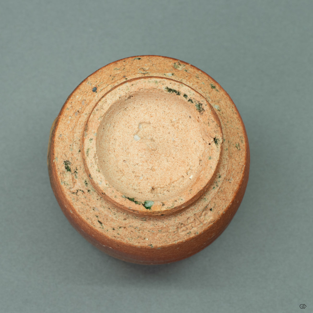 The unglazed foot (koudai) of the Shigaraki tea cup, showing  the natural, earthy texture of the clay from one of Japan's Six Ancient Kilns.