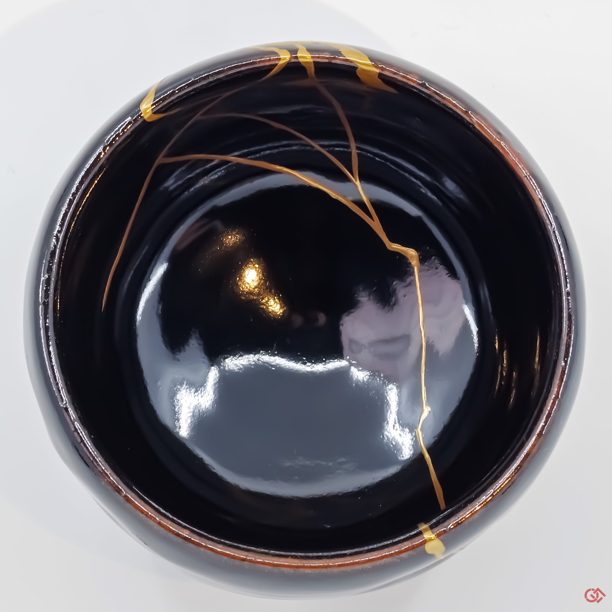 Photo of the bottom side of an authentic Kintsugi pottery piece, showing its overall design and features
