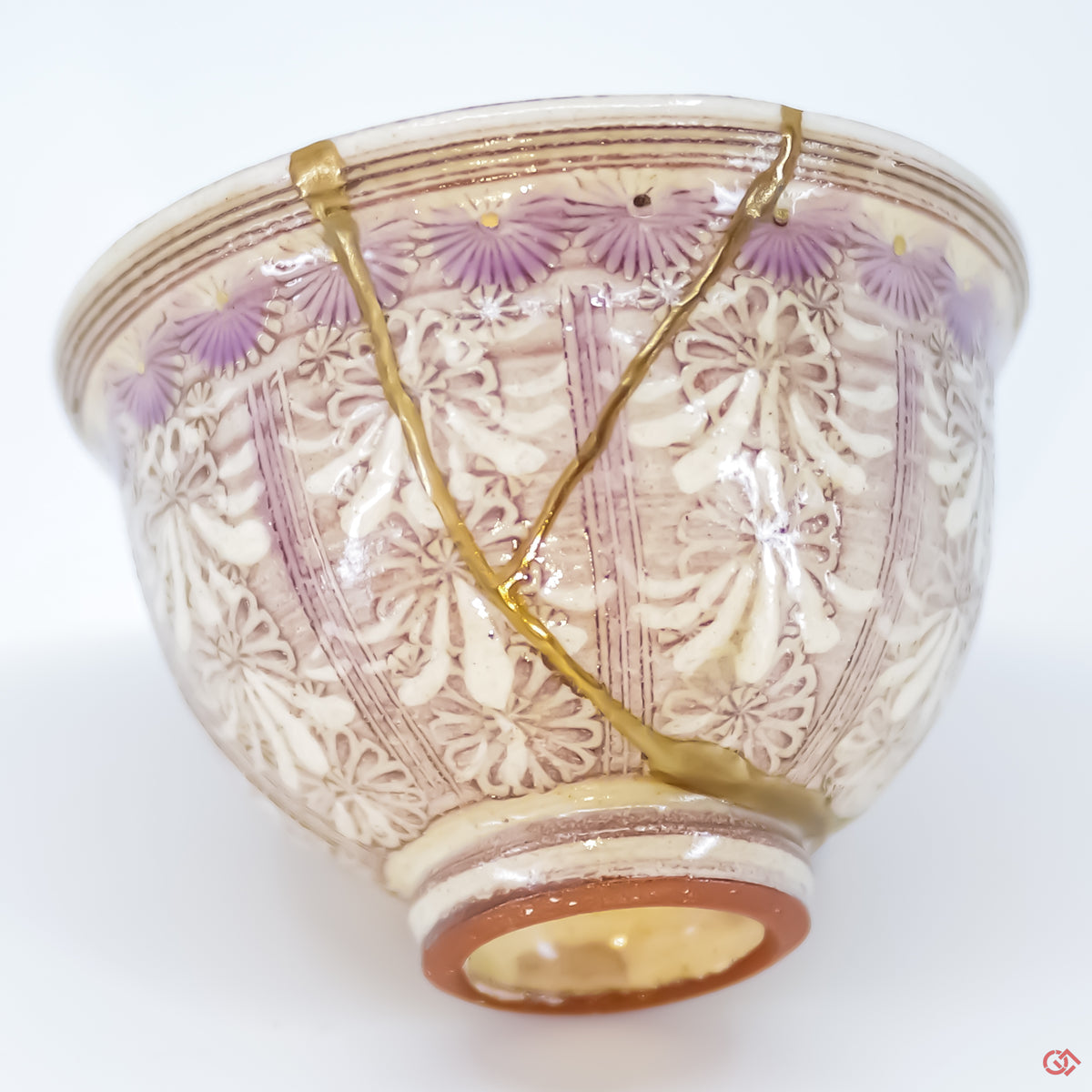 Close-up photo of an authentic Kintsugi pottery piece, showing the detail of its repairs and craftsmanship