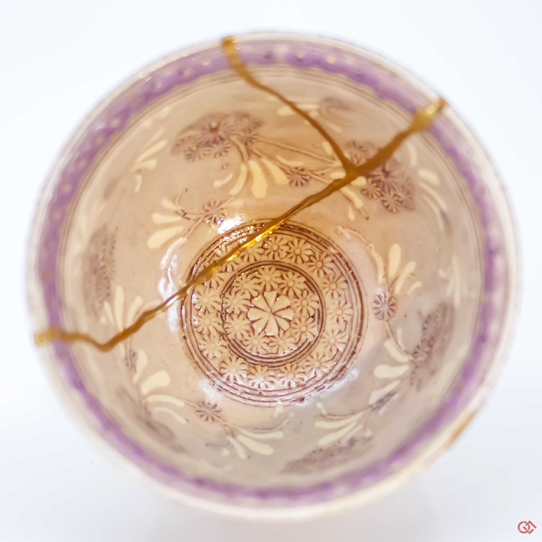 Close-up photo of an authentic Kintsugi pottery piece, showing the detail of its repairs and craftsmanship