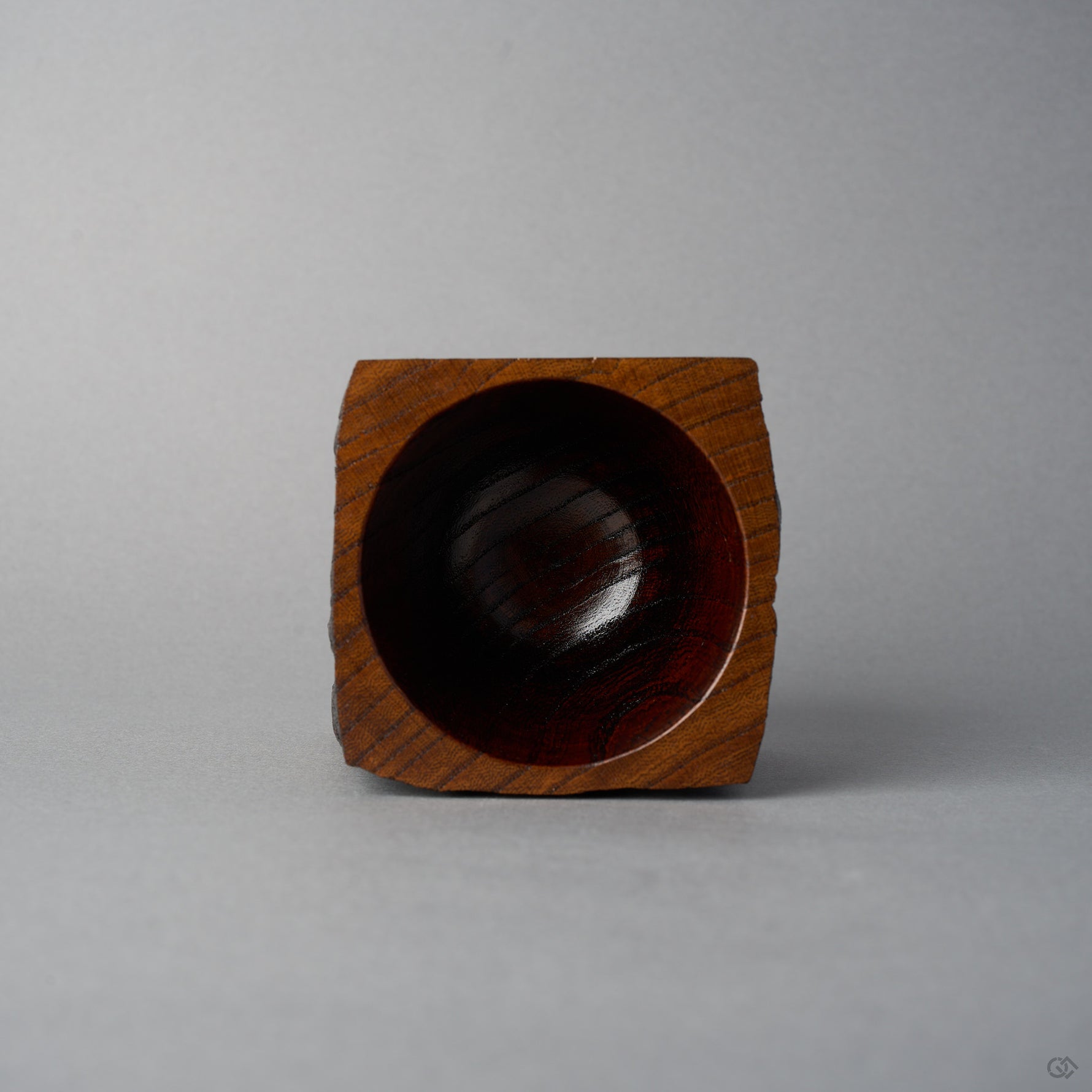 Top view of KODAMA Nashiji, looking down into the smoothly hollowed bowl with its glossy reddish wood-grain interior.