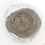 Photo of the bottom side of an authentic Kintsugi pottery piece, showing its overall design and features