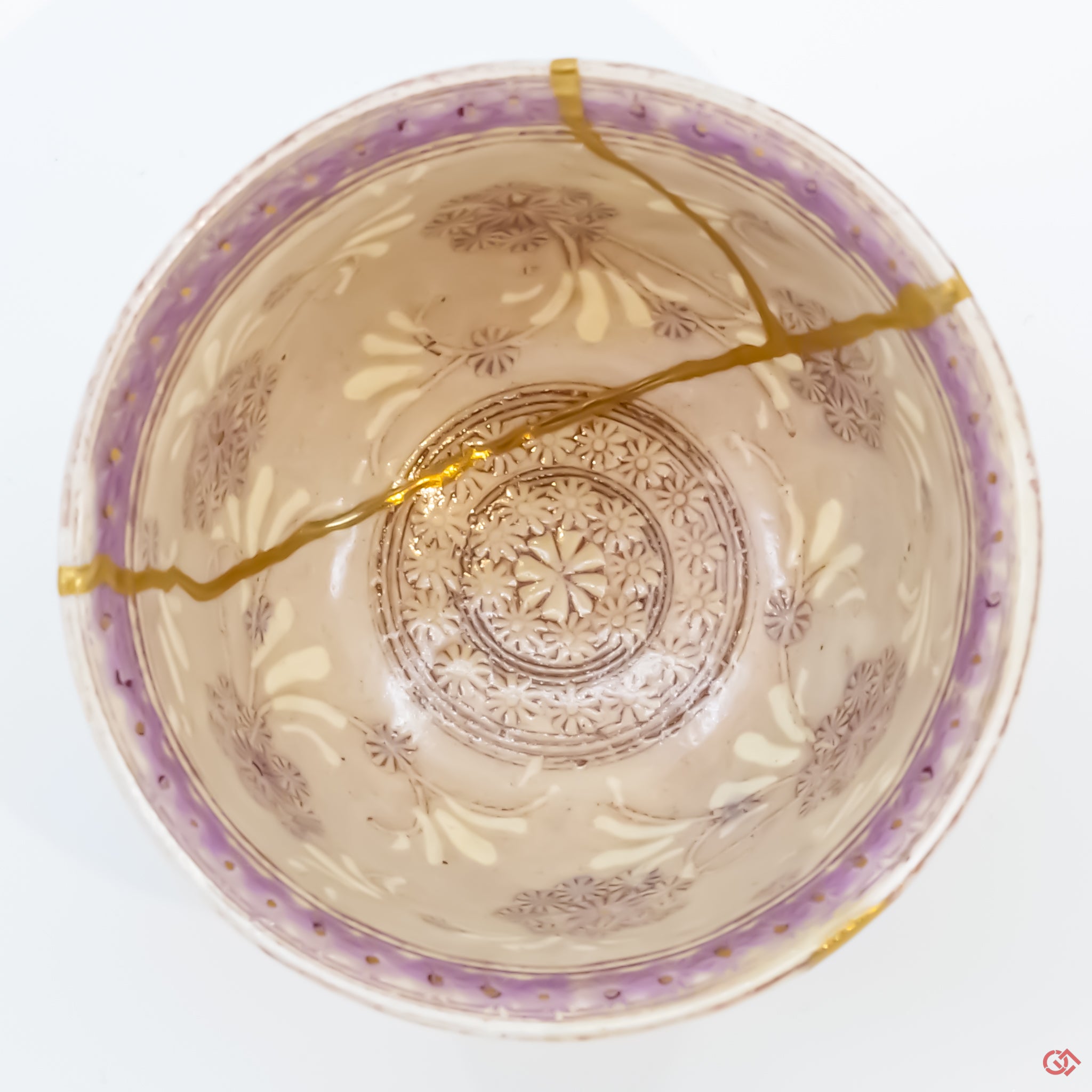 Photo of the top side of an authentic Kintsugi pottery piece, showing its overall design and features
